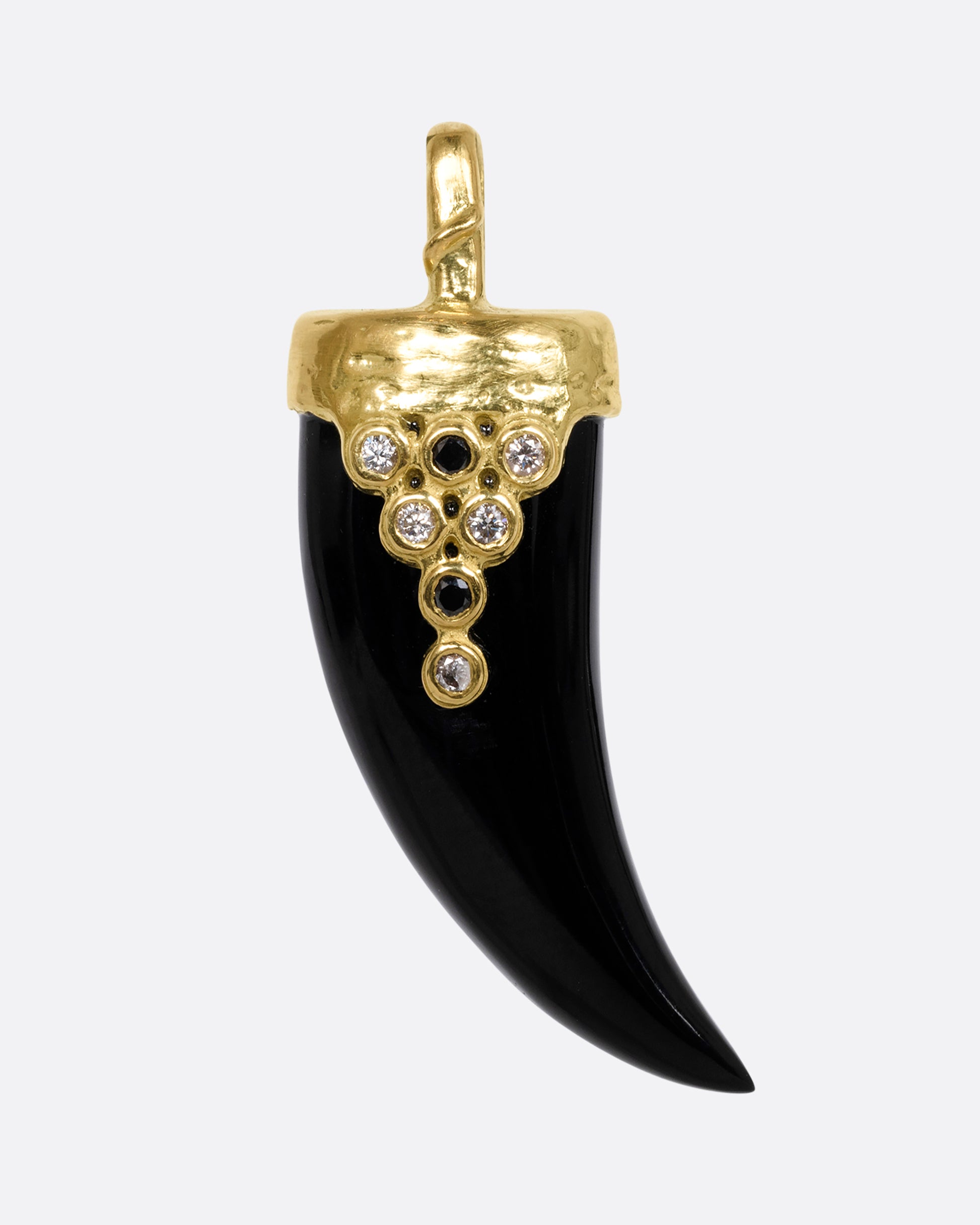 yellow gold tooth shaped onyx charm with black diamond and white diamond shown from the front