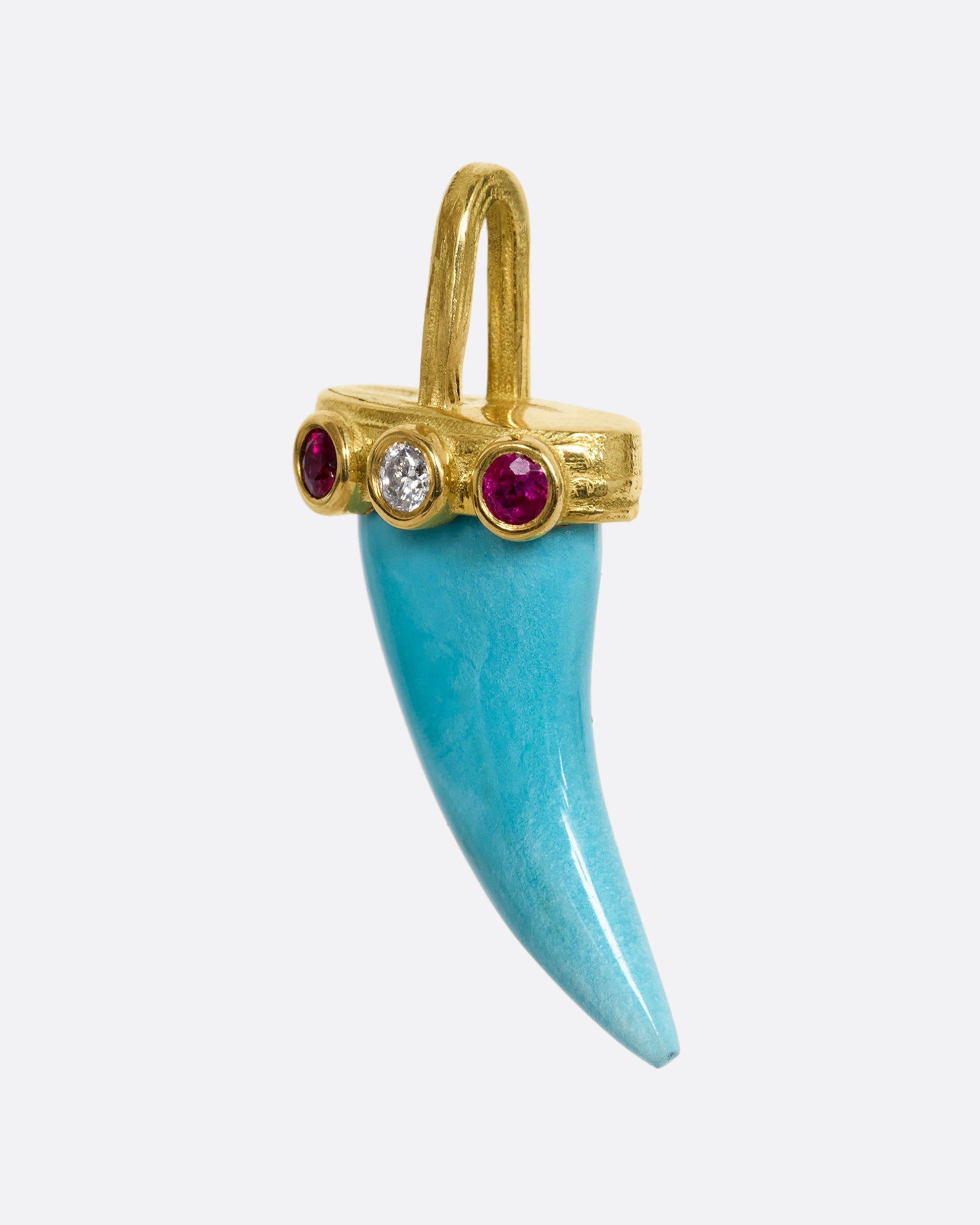 yellow gold tooth shaped turquoise charm shown from the side