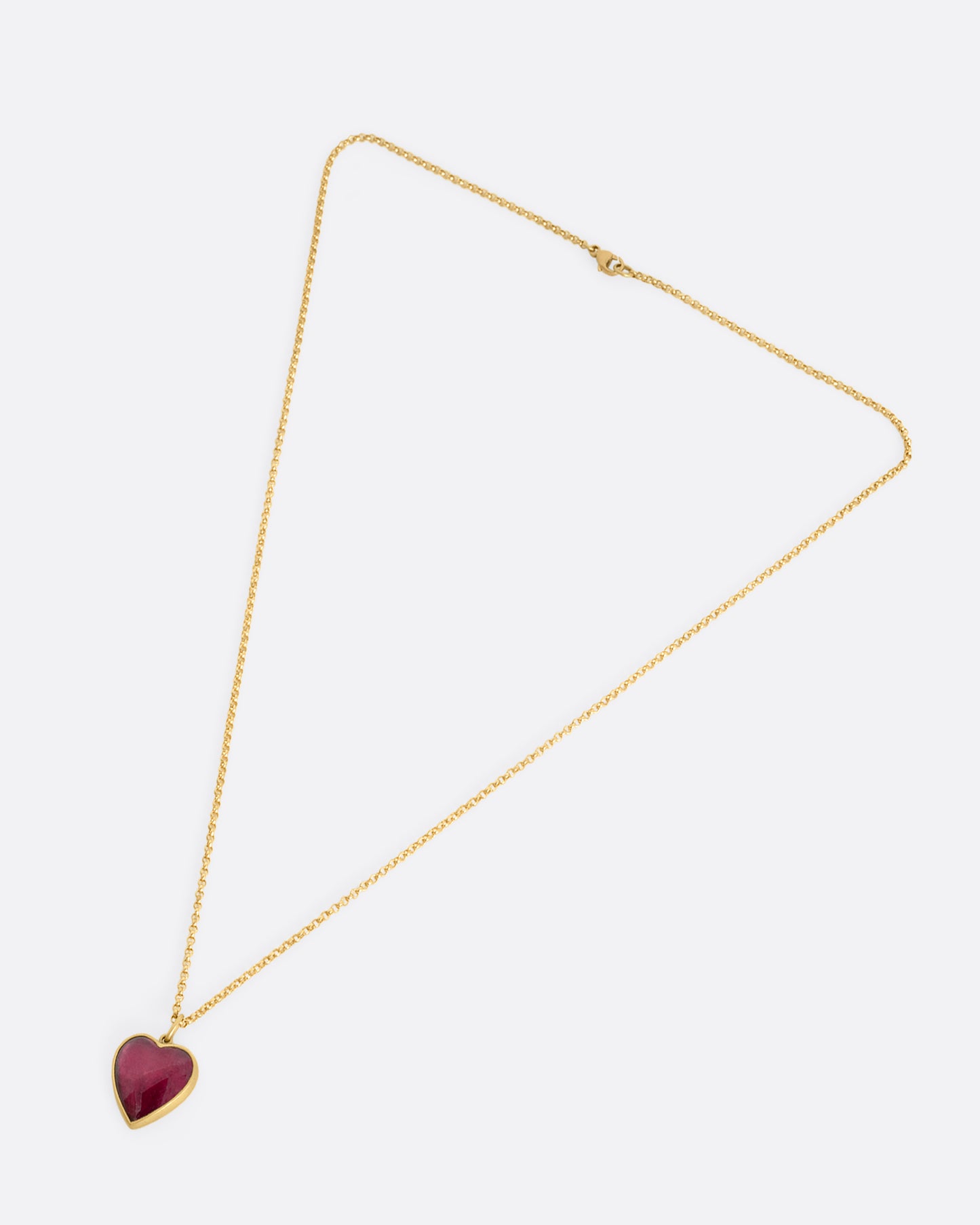 yellow gold necklace with a heart shaped tourmaline shown horizontally