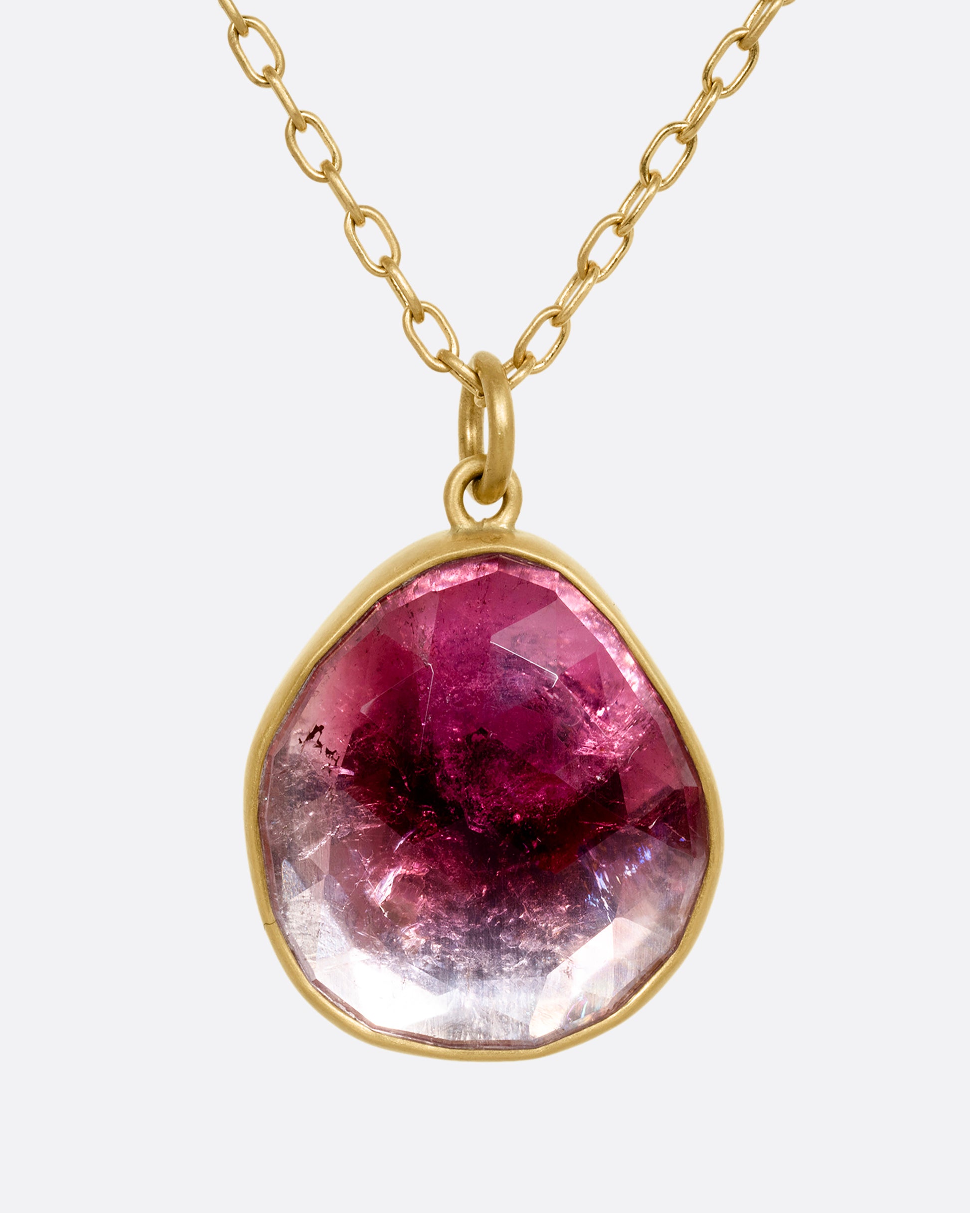 yellow gold necklace with an ombre pink tourmaline shown from the front