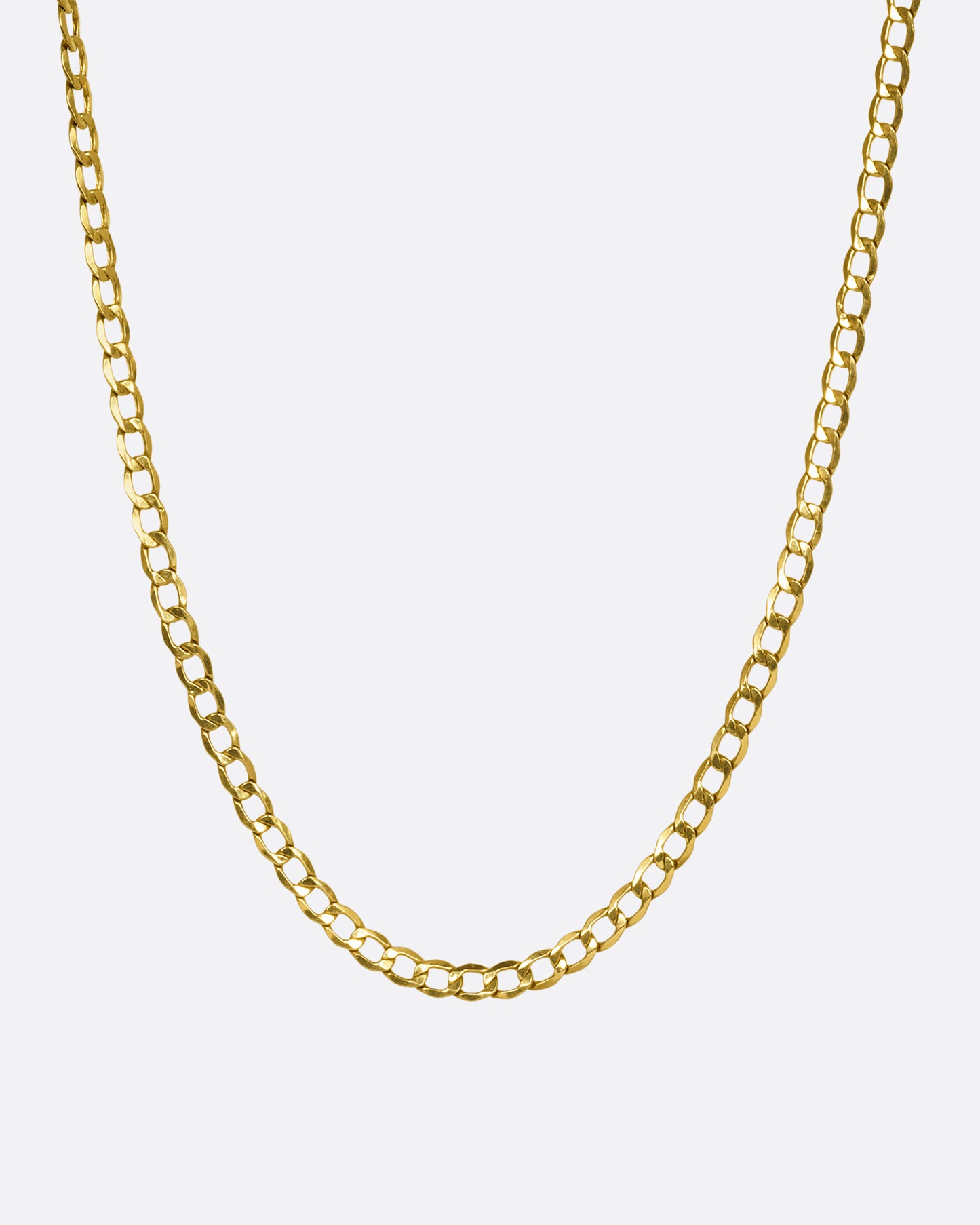 A yellow gold flat curb chain with wide links. Shown hanging from the front.