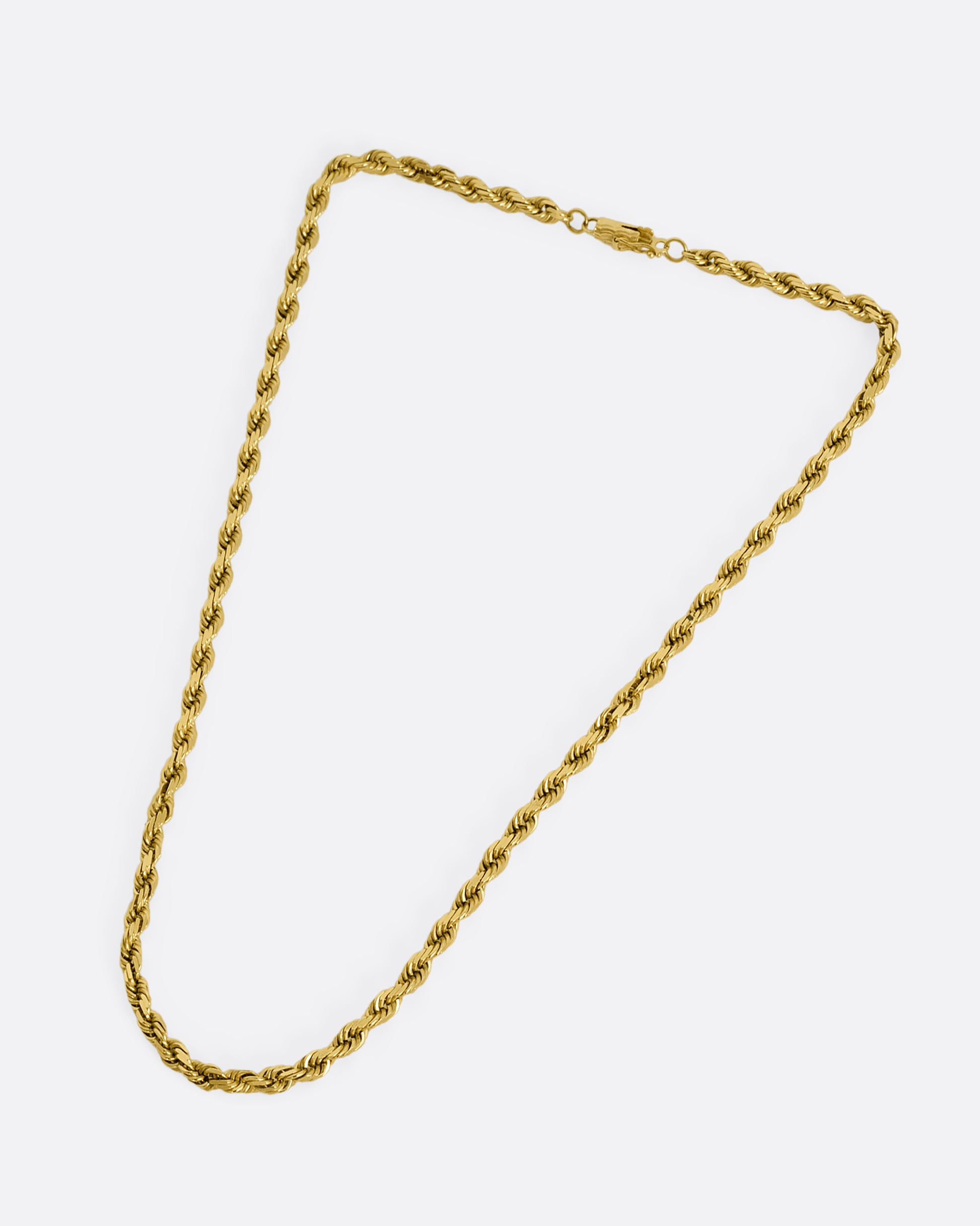 A yellow gold twisted rope chain. Shown laying flat, from above.