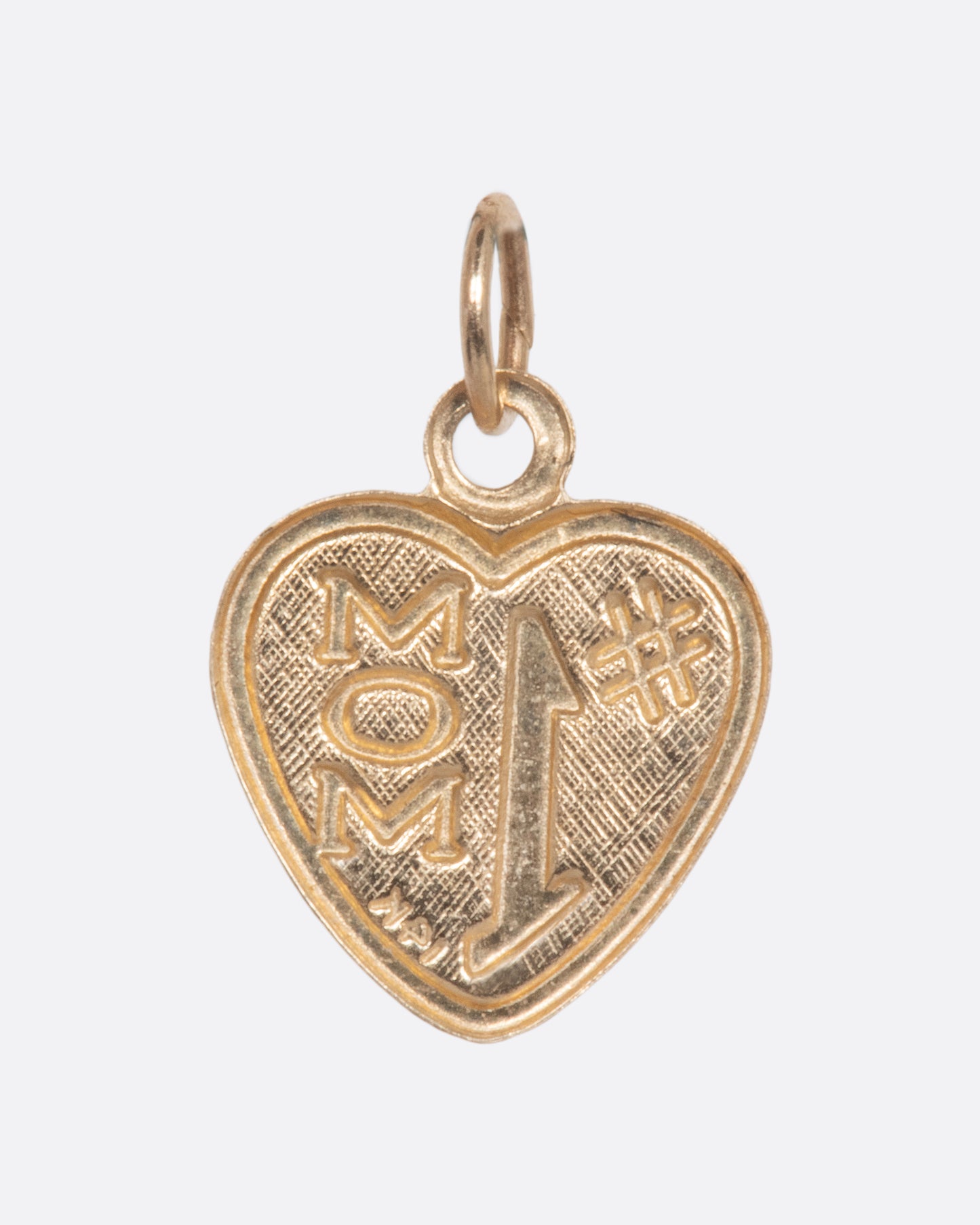 Gold heart shaped charm that reads '#1 Mom'. View from the back.