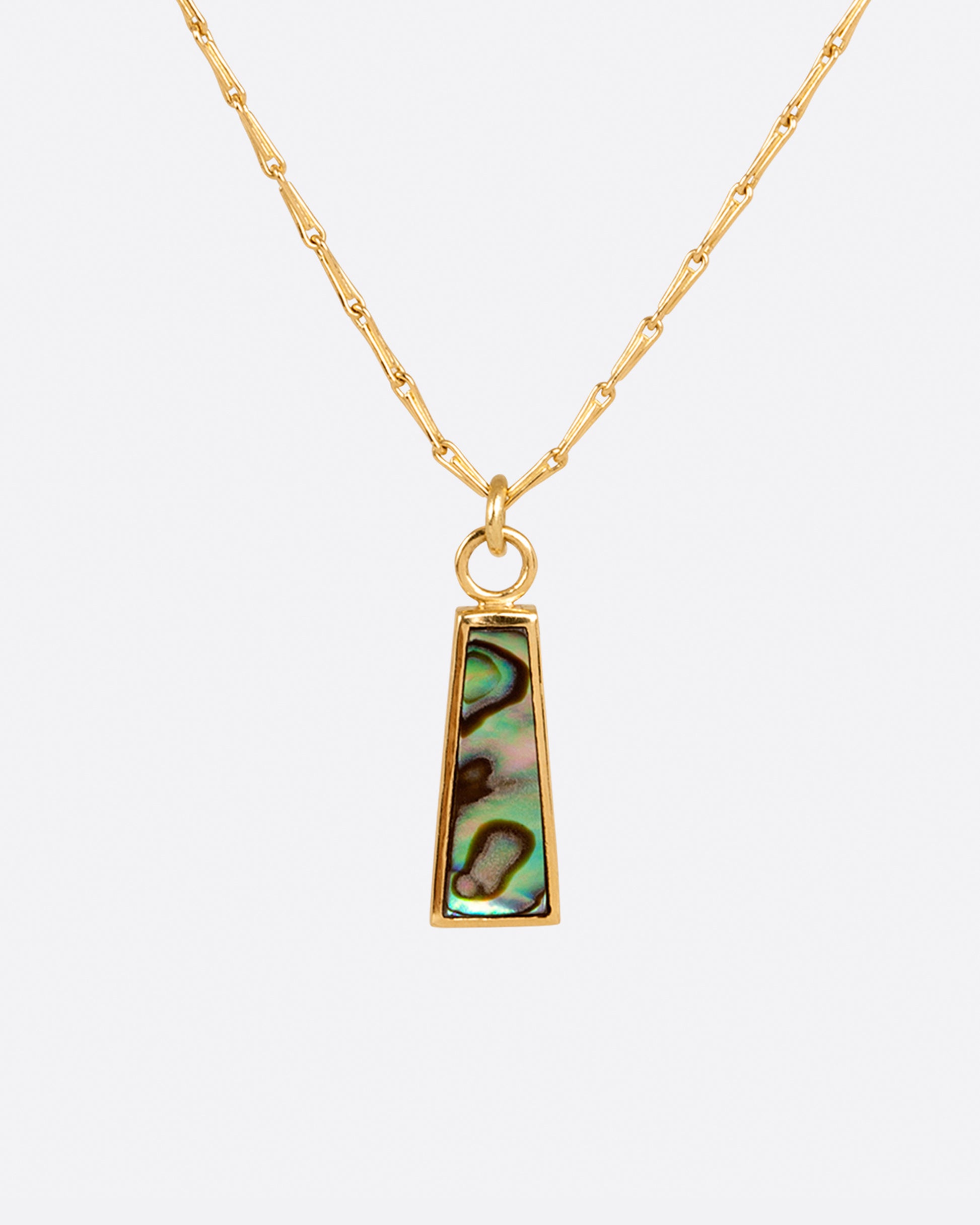 A long abalone trapezoid pendant hangs on a beautiful barley corn chain.