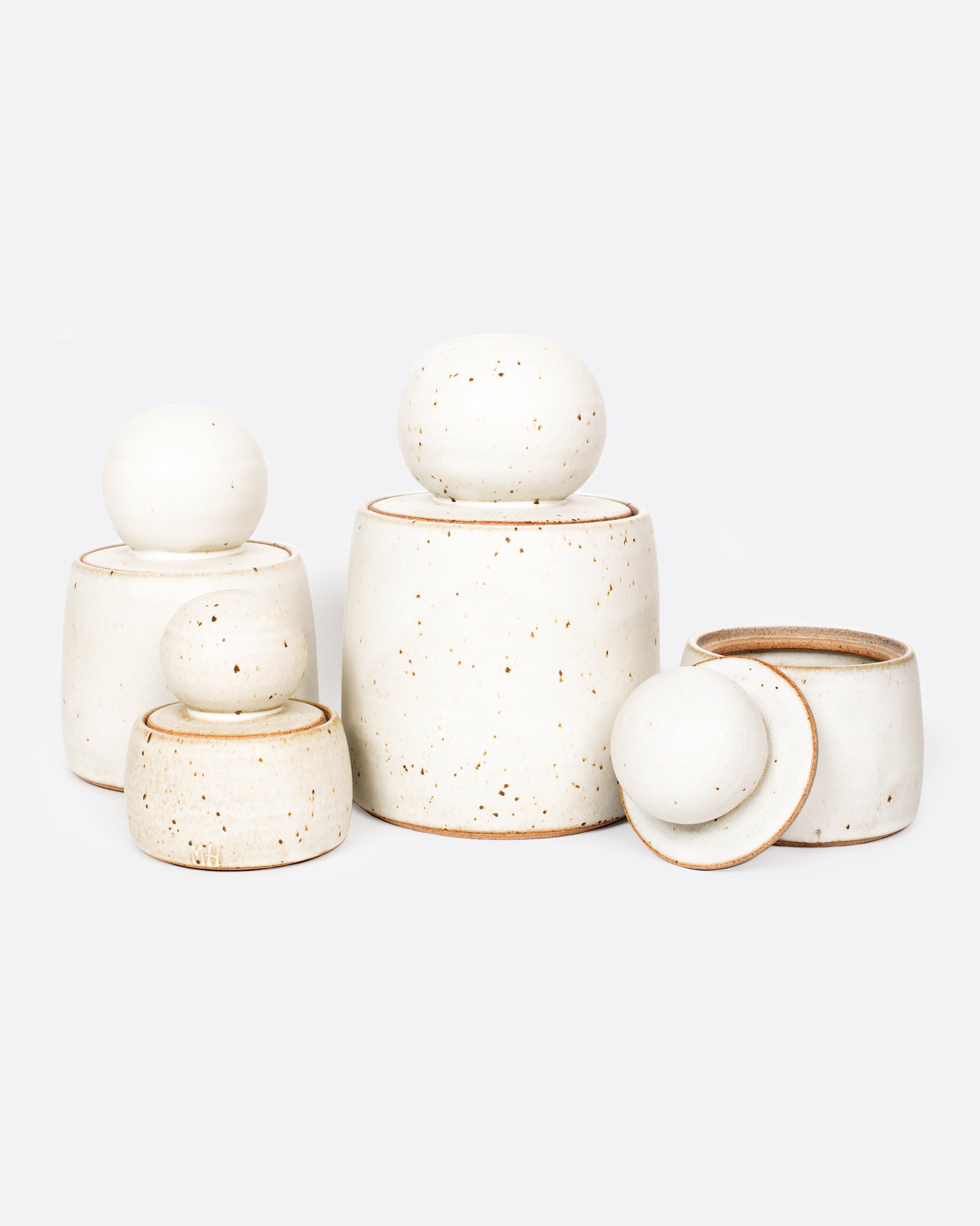 These lidded canisters come in several sizes and make a lovely set or individual containers that are perfect for anything from cookies to q-tips.