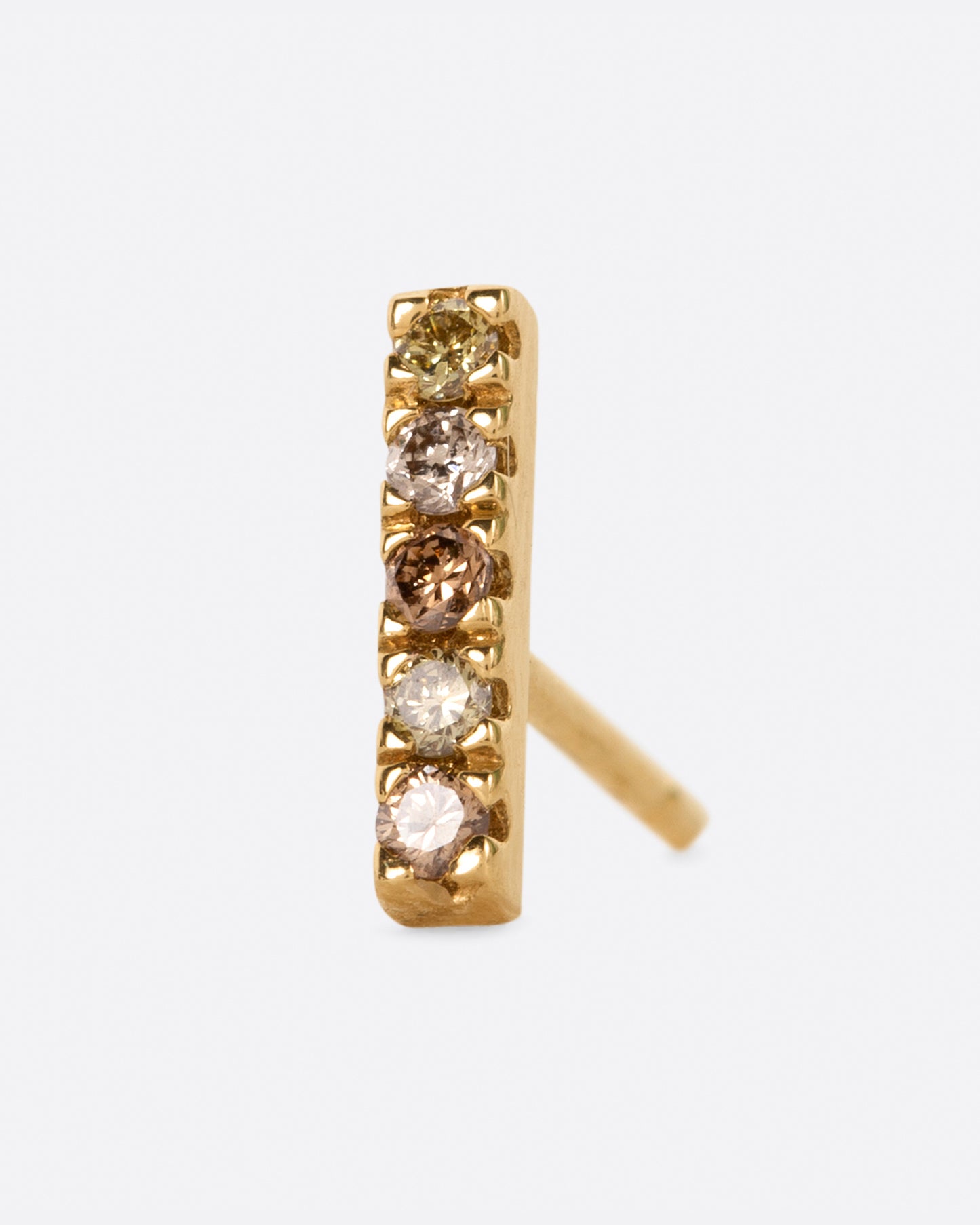 A classic bar stud with a mix of olive, dark and light champagne diamonds.