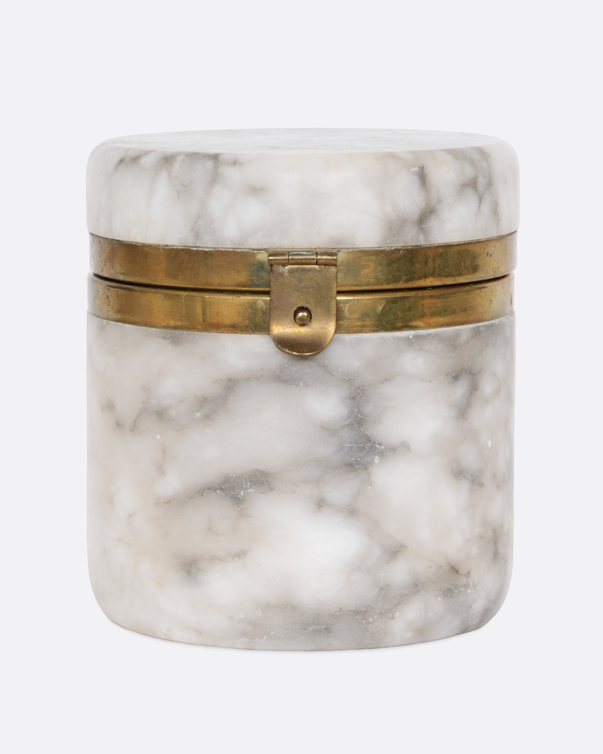 A lidded white alabaster box with gold trim and a clasp. Shown from the front.