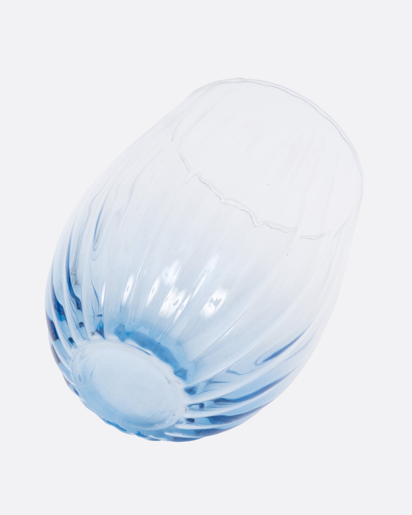 A single ridged glasses with a blue tint, shown from the back.