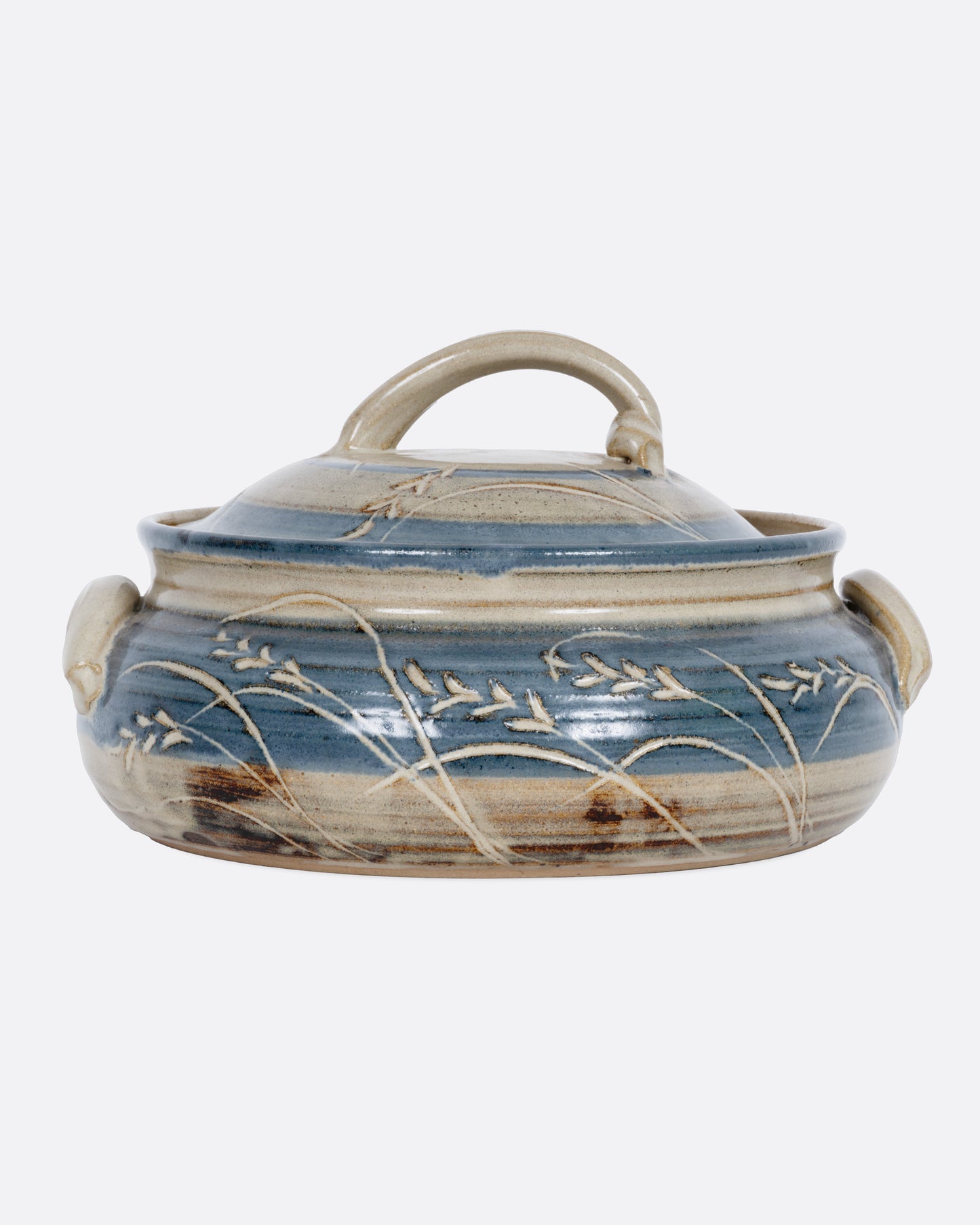 A blue and gray casserole dish with a domed lid and handles. Shown from the front.