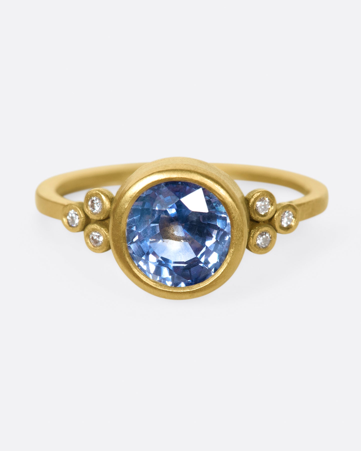 The stunning, periwinkle blue sapphire at the center of this ring is the star of the show.