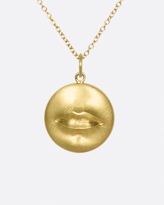 A solid, heavy pendant with a striking, sensual design with a sense of humor.