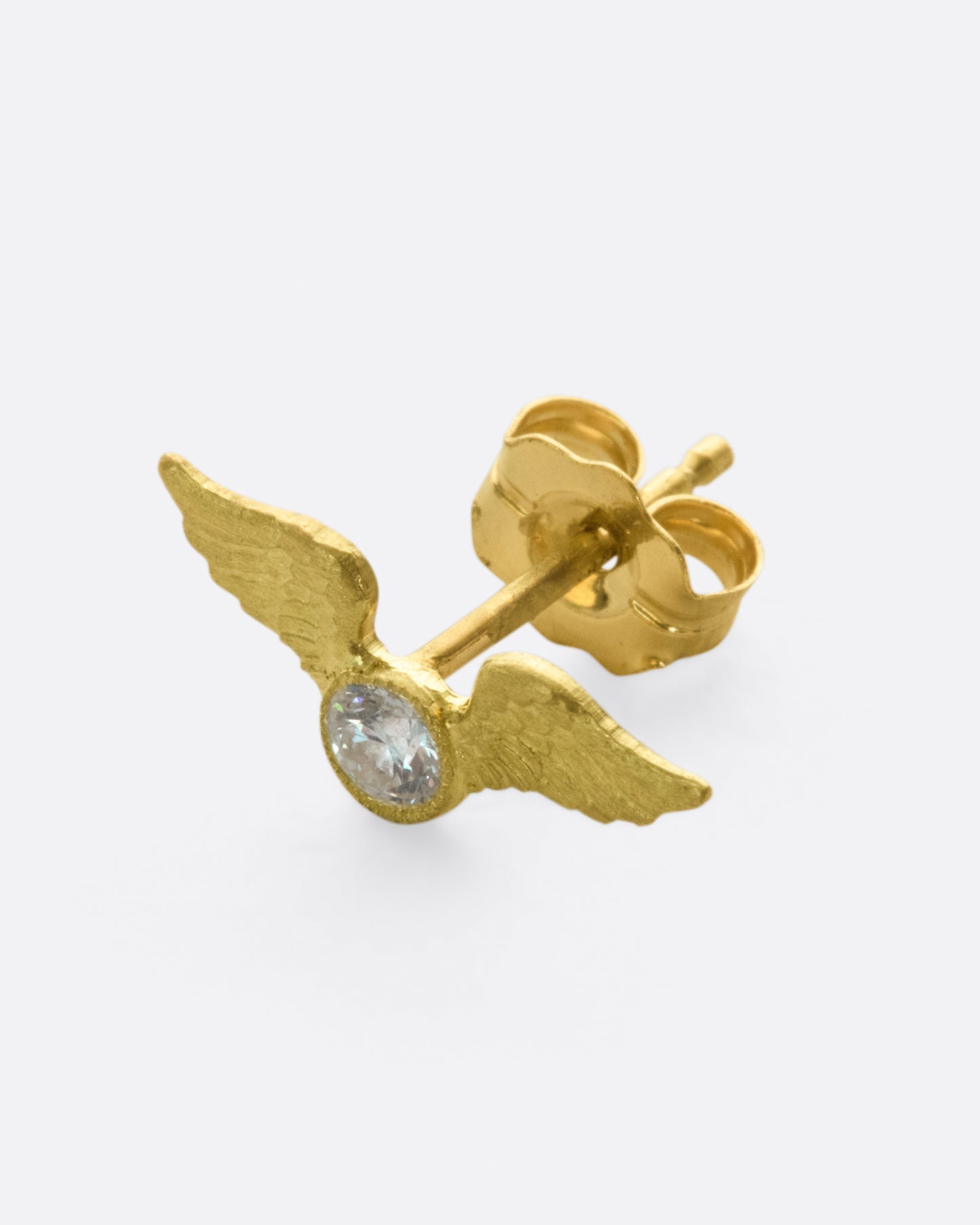 This little stud is inspired by the winged mountings and pavé wing pieces of late Victorian jewelry.