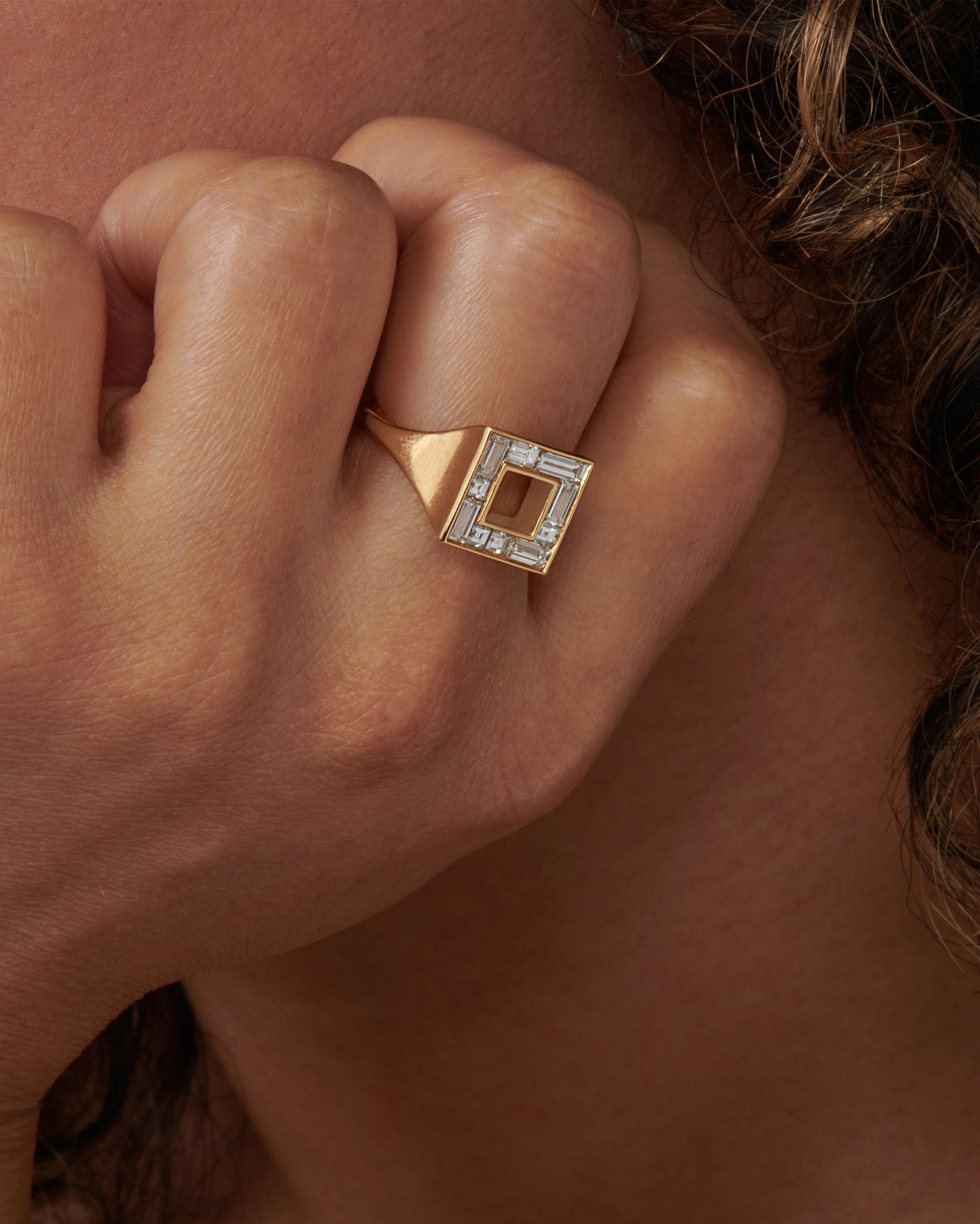 A geometric signet ring with baguette and carre-cut diamonds