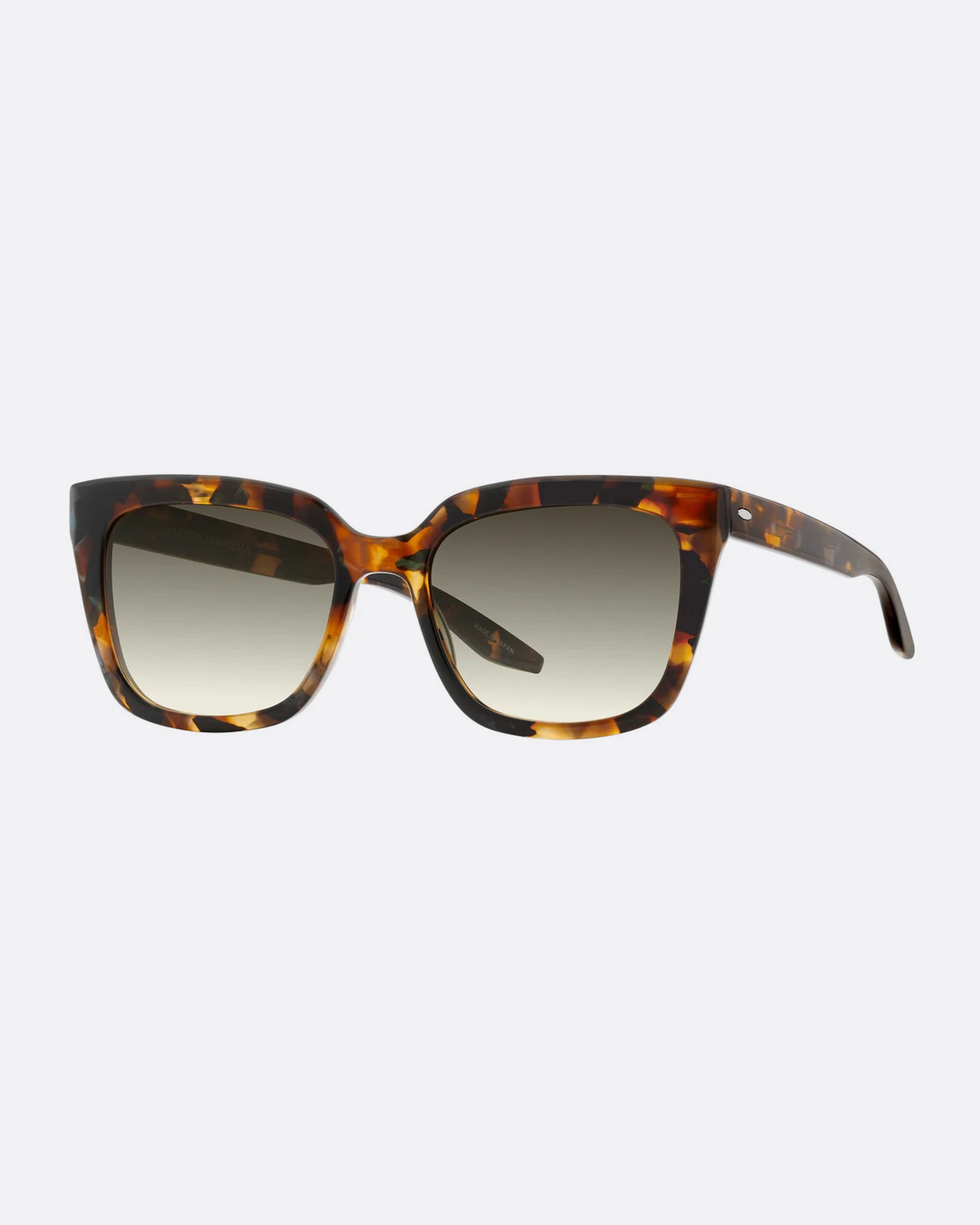 A pair of sunglasses with thick, squared tortoiseshell frames and olive gradient lenses. Shown diagonally from the front.