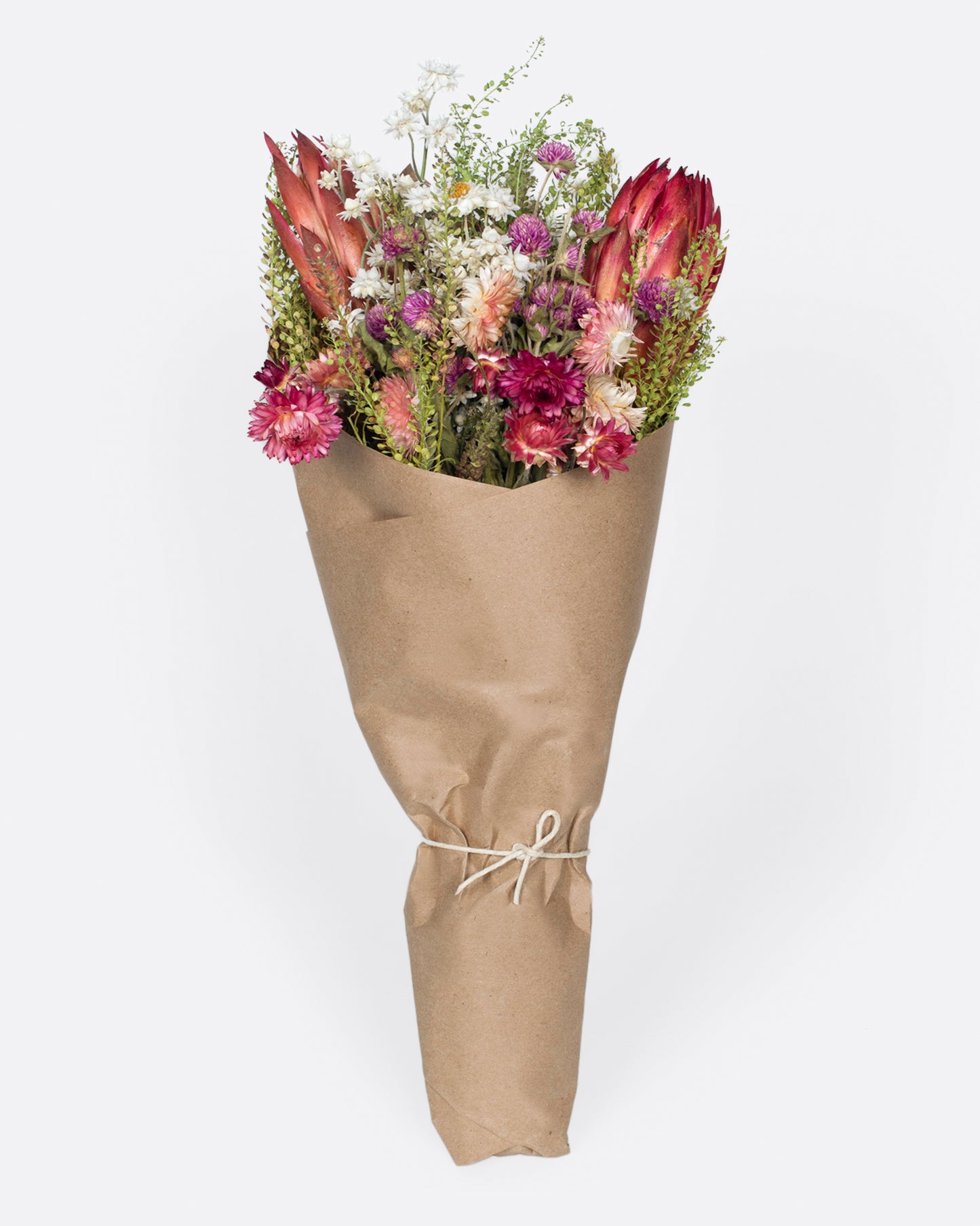 A dried flower bouquet in assorted shades of pink, white, and red.