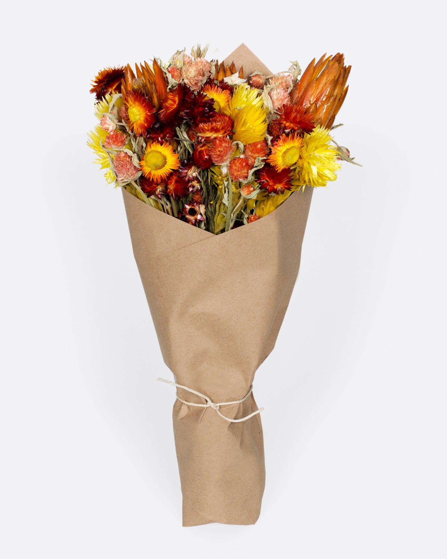 A warm dried floral arrangement of reds and yellows.