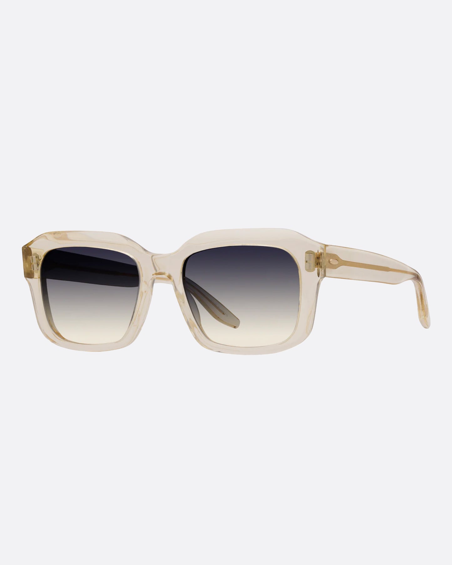 A pair of clear champagne acetate sunglasses with gray ombré lenses. Shown from the side.
