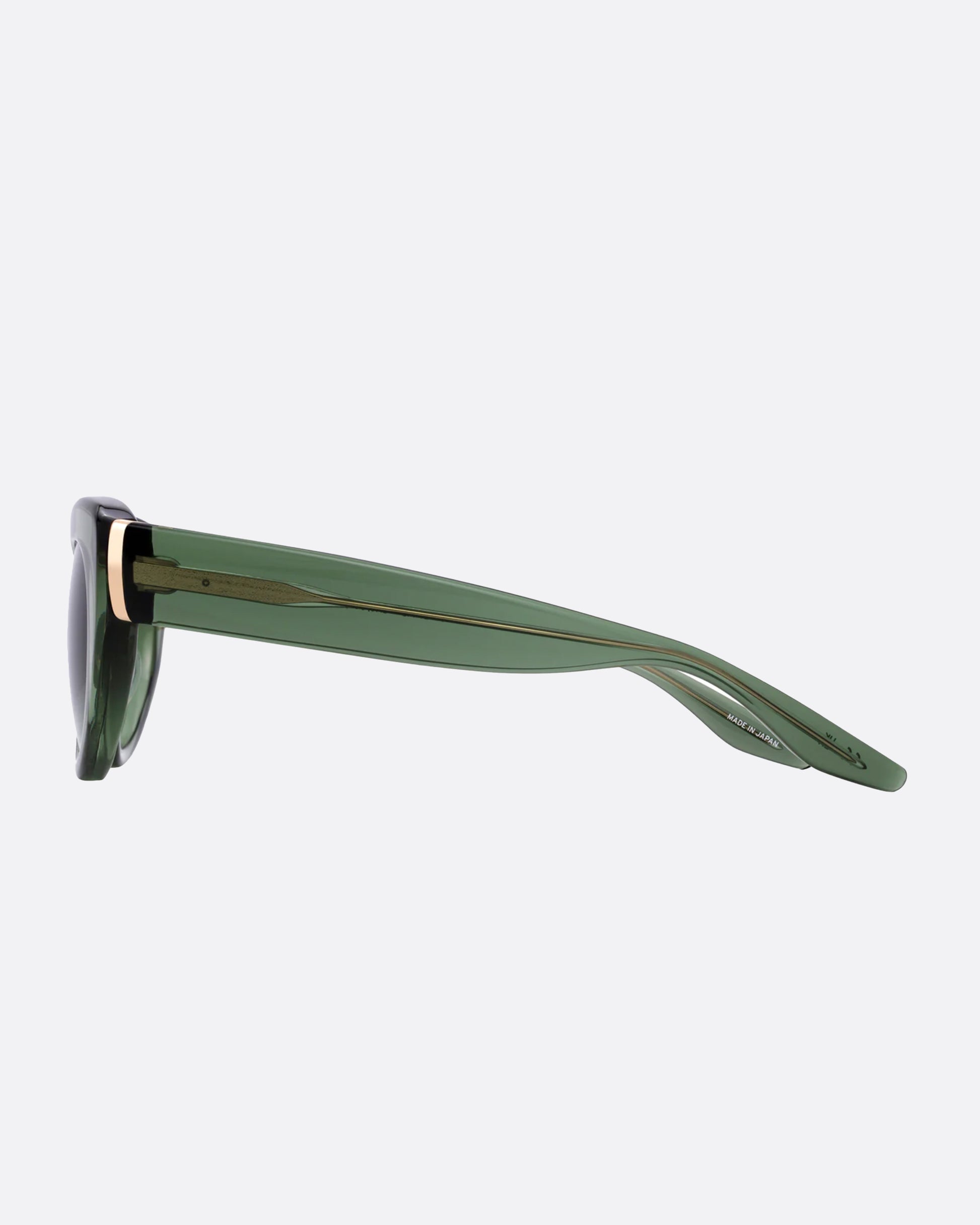 A playful cat-eye silhouette with 24k gold plated titanium details, this time in a transparent sage green with matching gradient lenses.