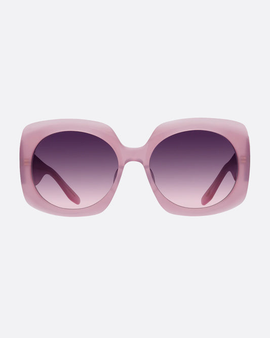 A pair of substantial frames with chic curves in a semi-transparent magnolia pink with gradient lenses.