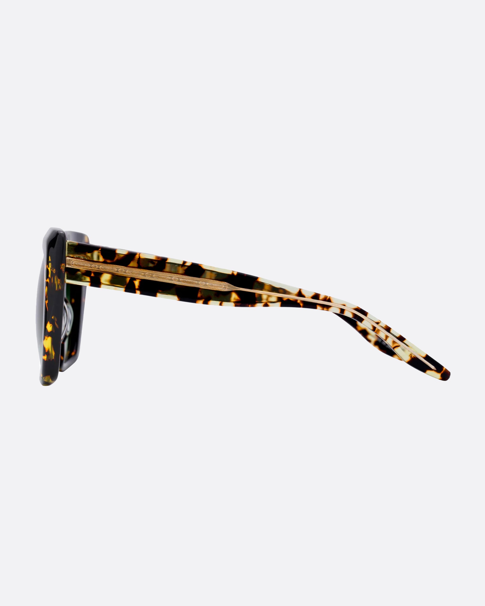 A bold, beveled acetate frame with a 24k gold plated titanium core in the most perfect tortoise with green gradient lenses.