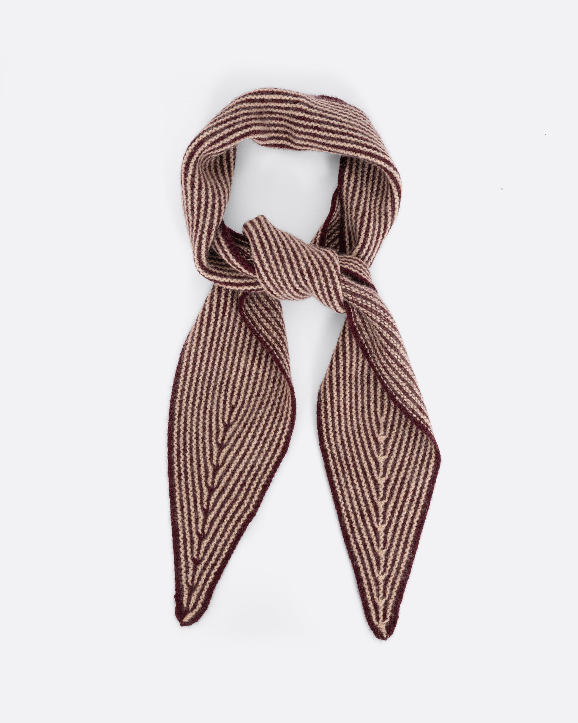 A red striped cashmere scarf, shown tied.