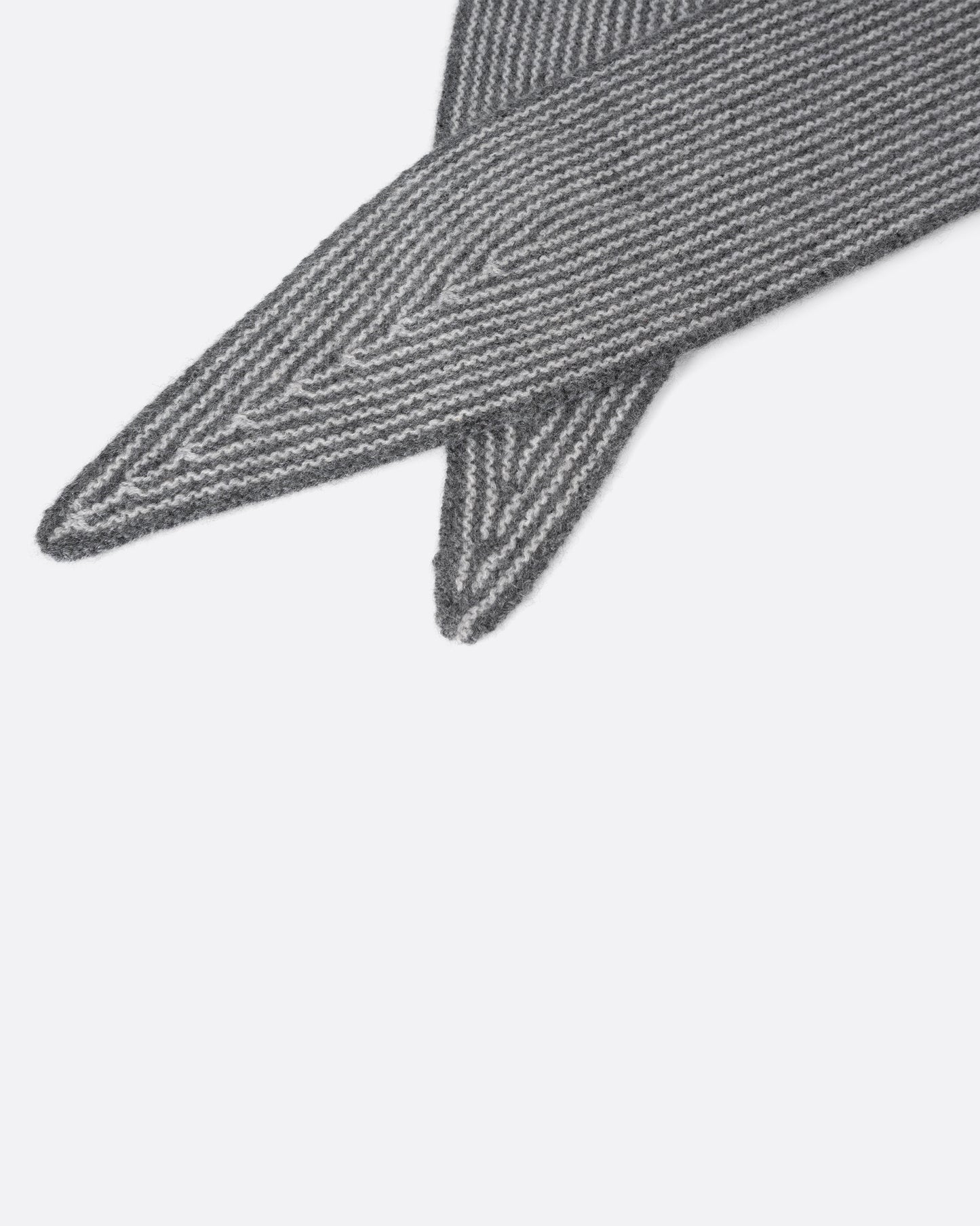 A grey striped cashmere scarf, shown close up.