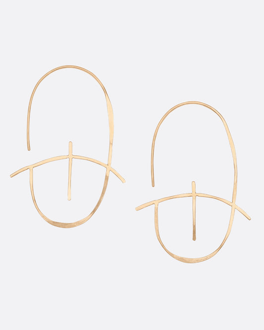 A geometric earring made of thin yellow gold with a hammered finish