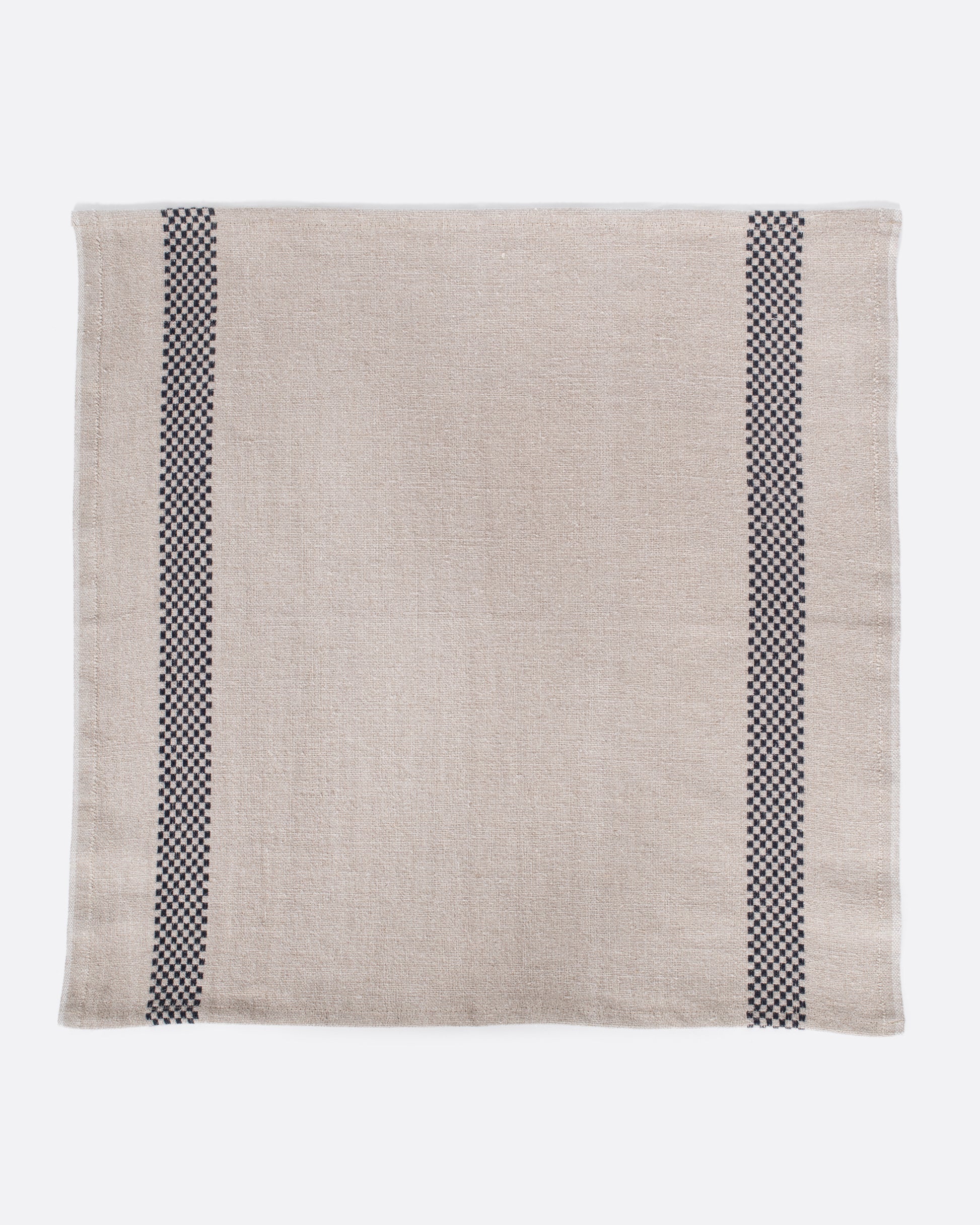 Natural linen napkin with black checkered embroidery