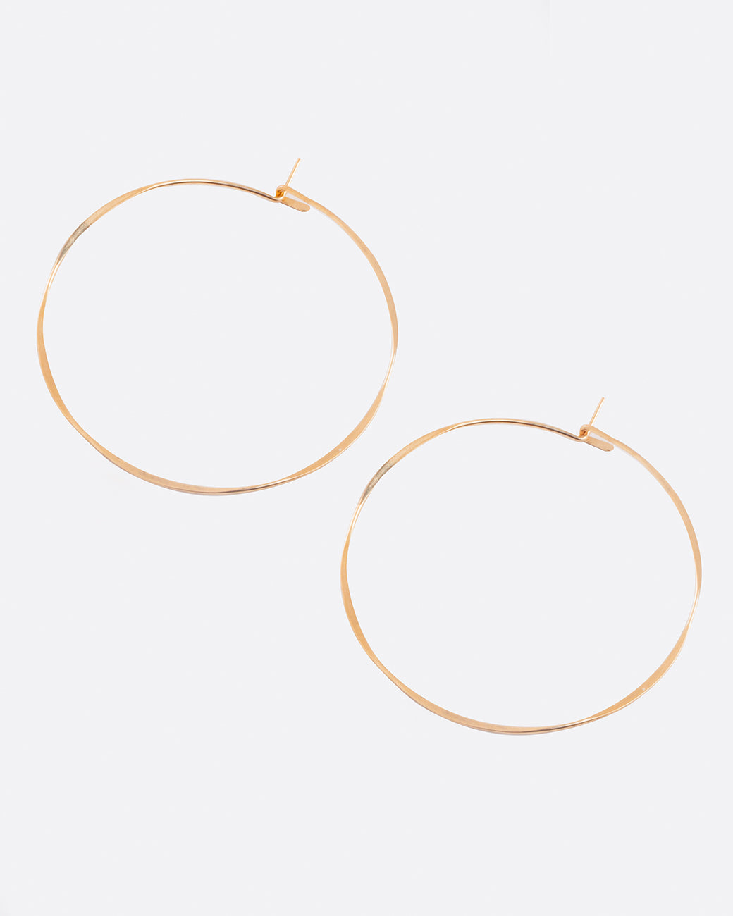 Fairmined gold, hand-hammered, large round hoop earrings that close upon themselves.