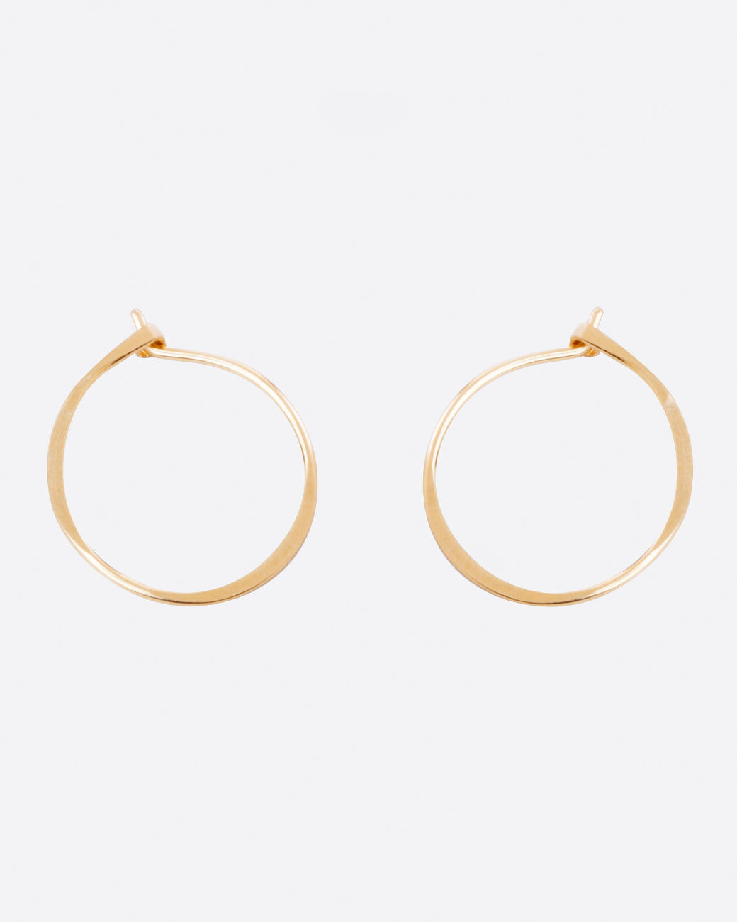 Fairmined gold, hand-hammered round hoop earrings that close upon themselves.