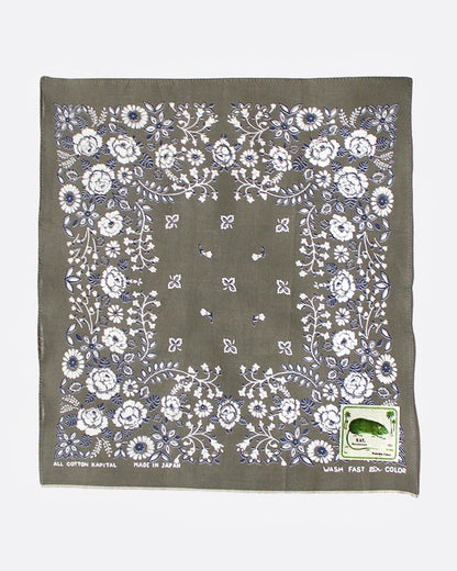 A khaki bandana with a floral print, shown from the front.