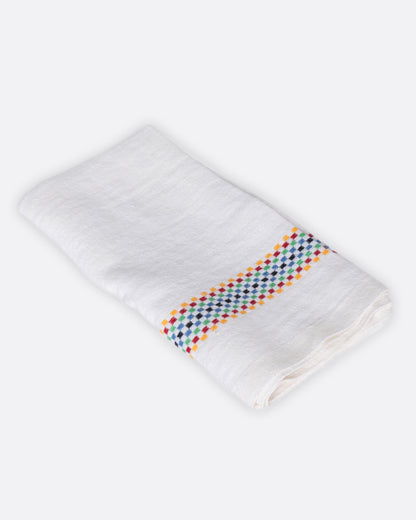 White linen napkin with multicolor stripe, folded