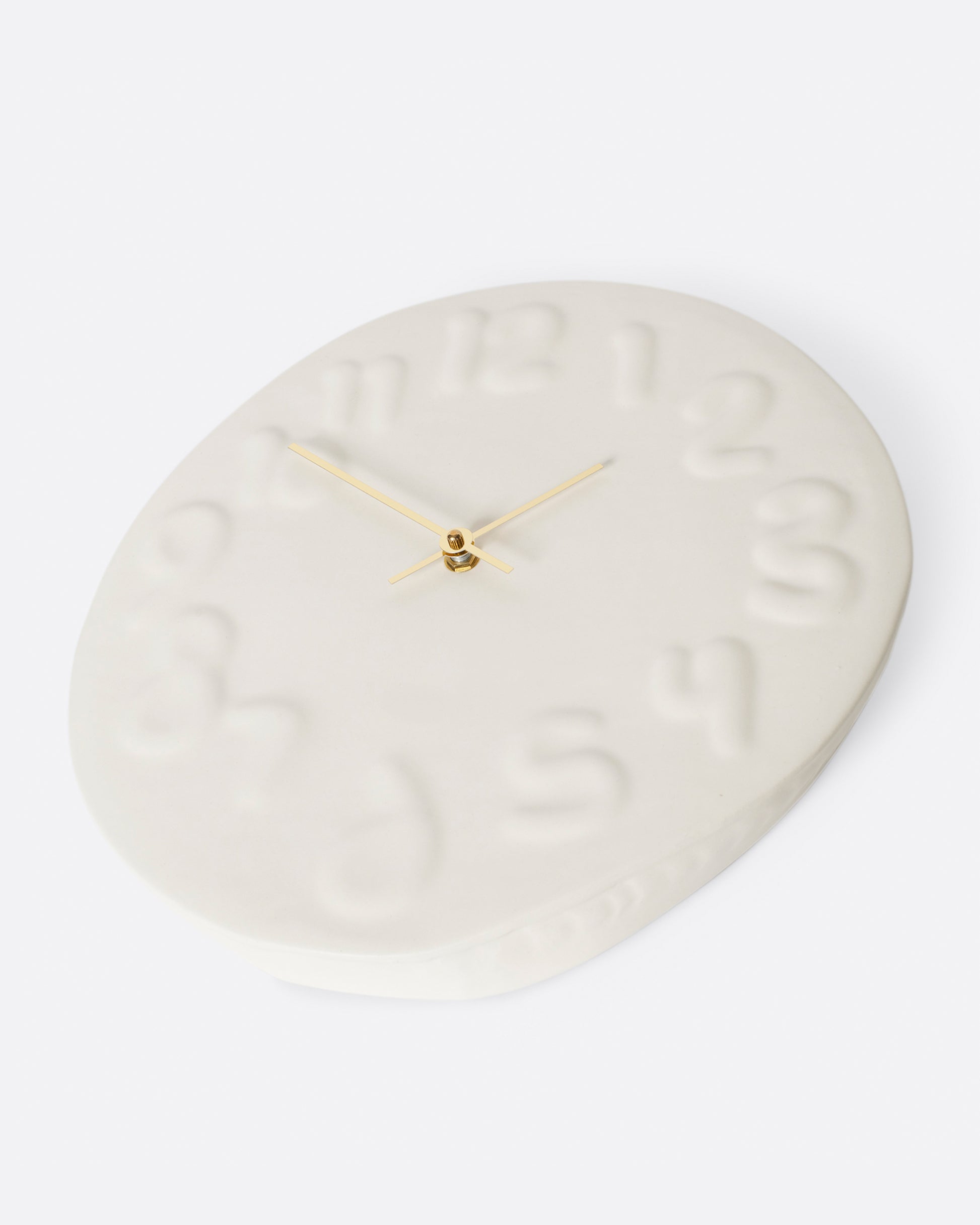 This handmade clock has brass hands and is a fun, yet subtle addition to any wall.