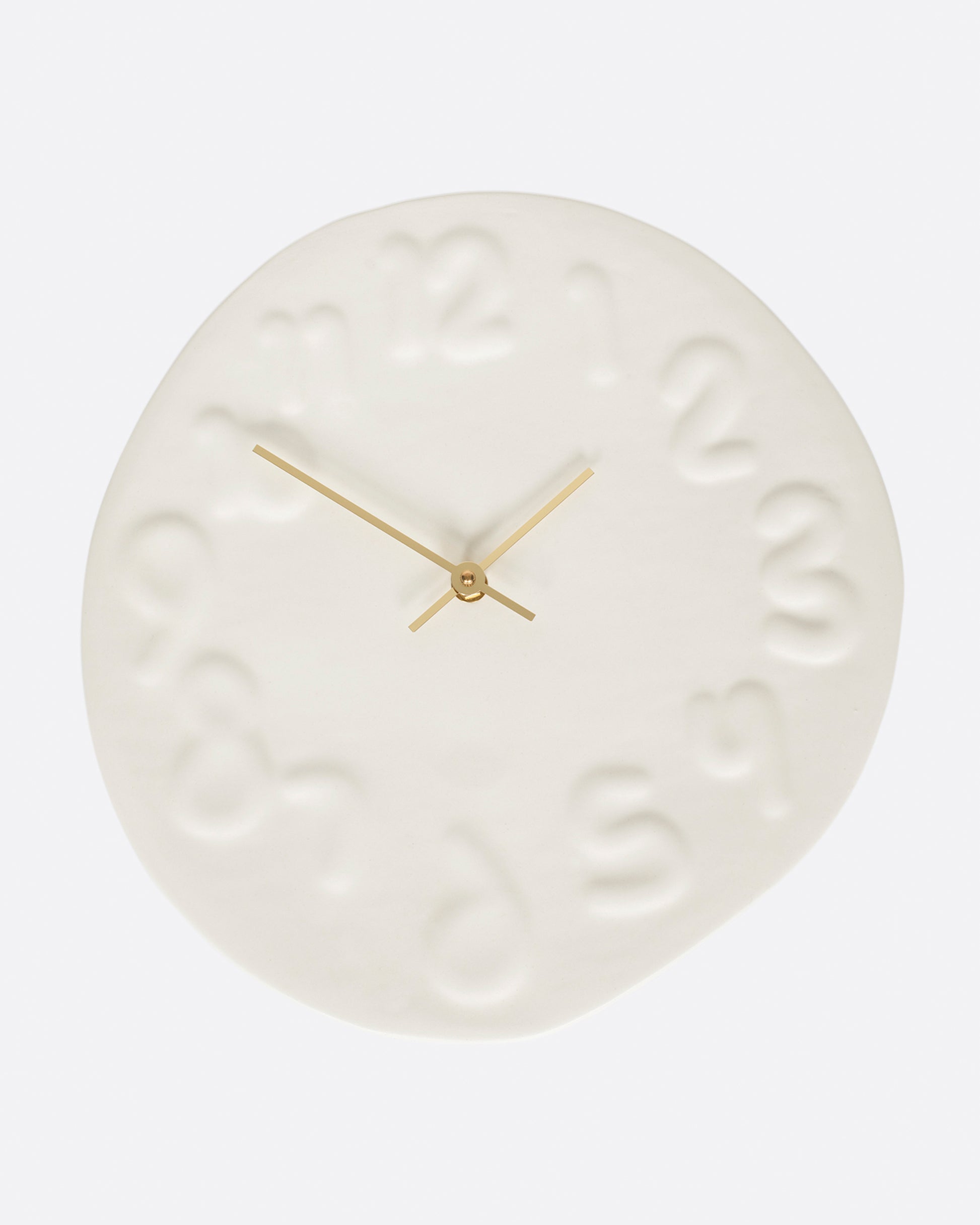 This handmade clock has brass hands and is a fun, yet subtle addition to any wall.