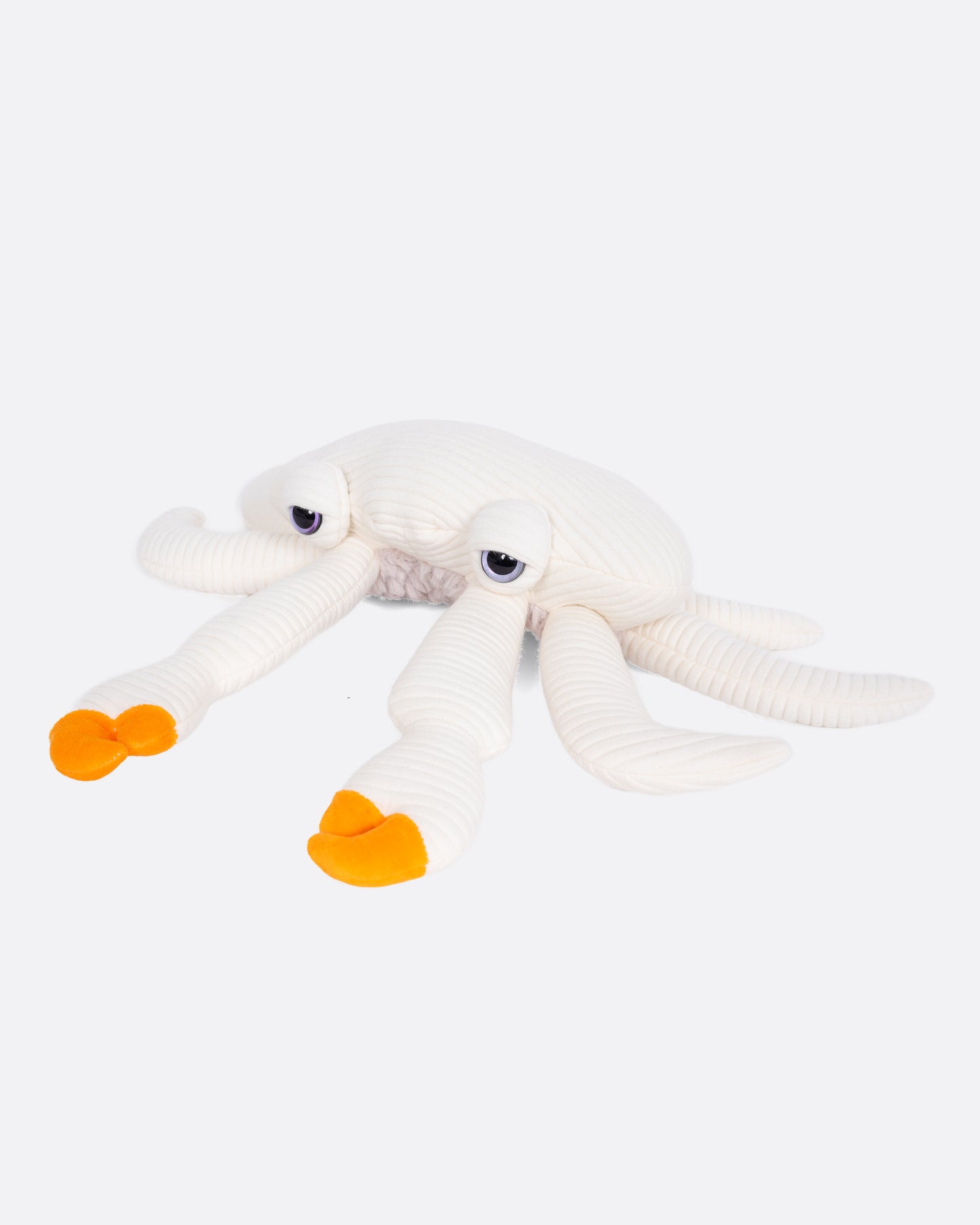 A white plushie crab with orange claws.