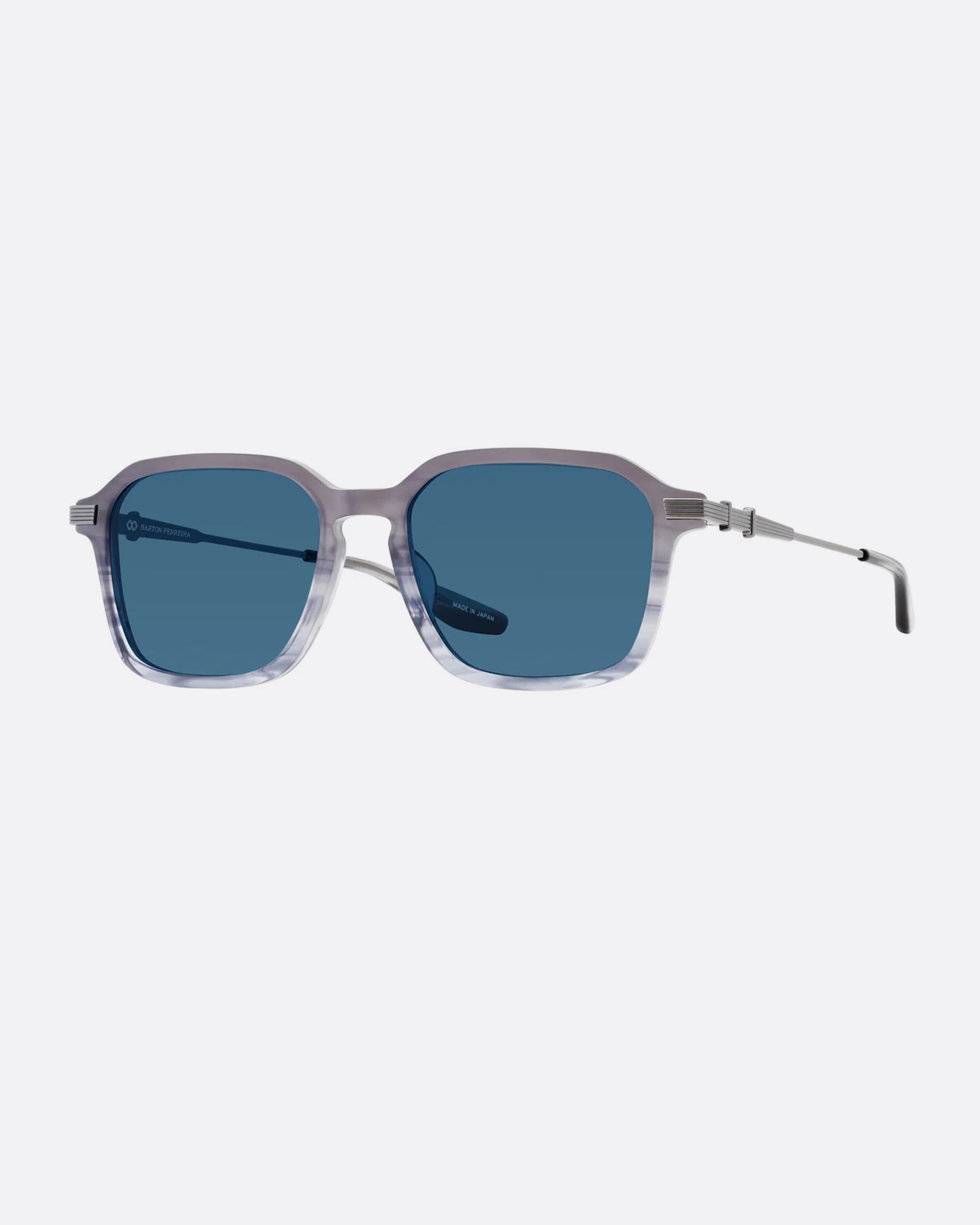 A pair of sunglasses with pearl gray frames and blue lenses. Shown diagonally from the front.