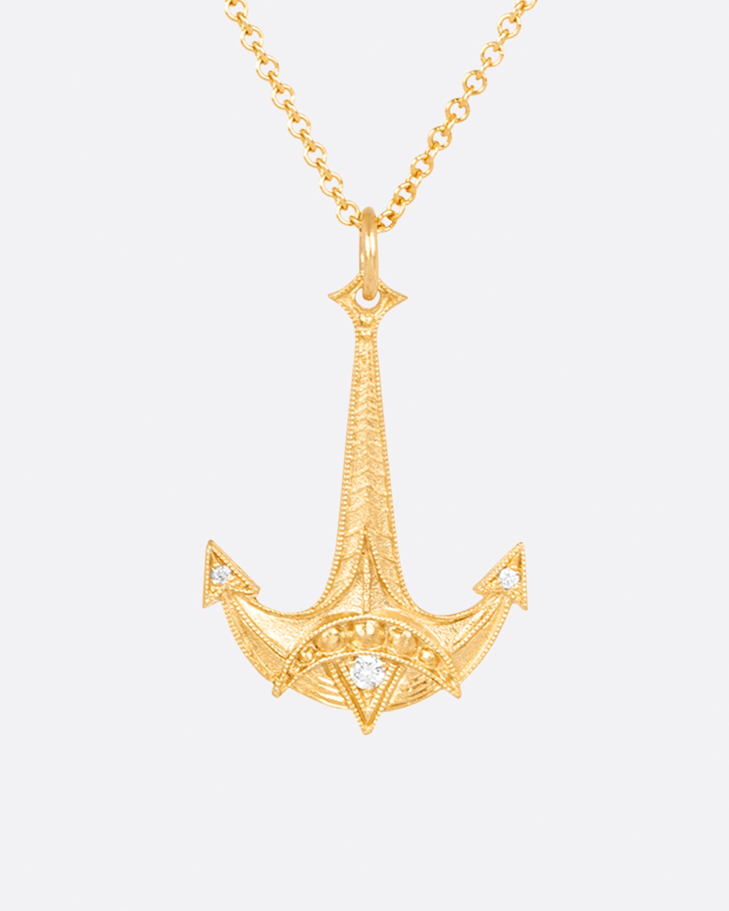 This diamond-dotted Jonah's Anchor necklace symbolizes hope and redemption