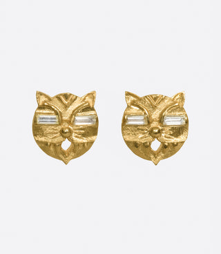 A pair of lucky cat earrings with glowing diamond eyes.