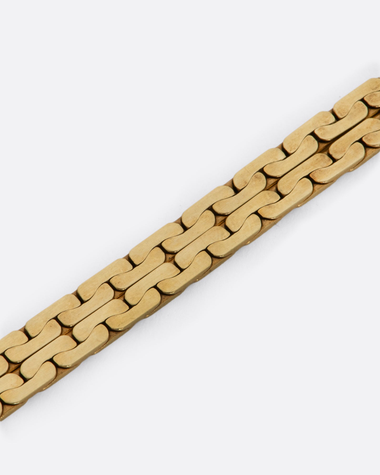 Yellow gold double strand flat cable link chain bracelet. View close up.