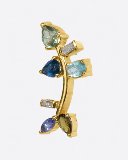 This elegant 14k gold stud, dotted with blue and green gemstones, reminds us of an olive branch