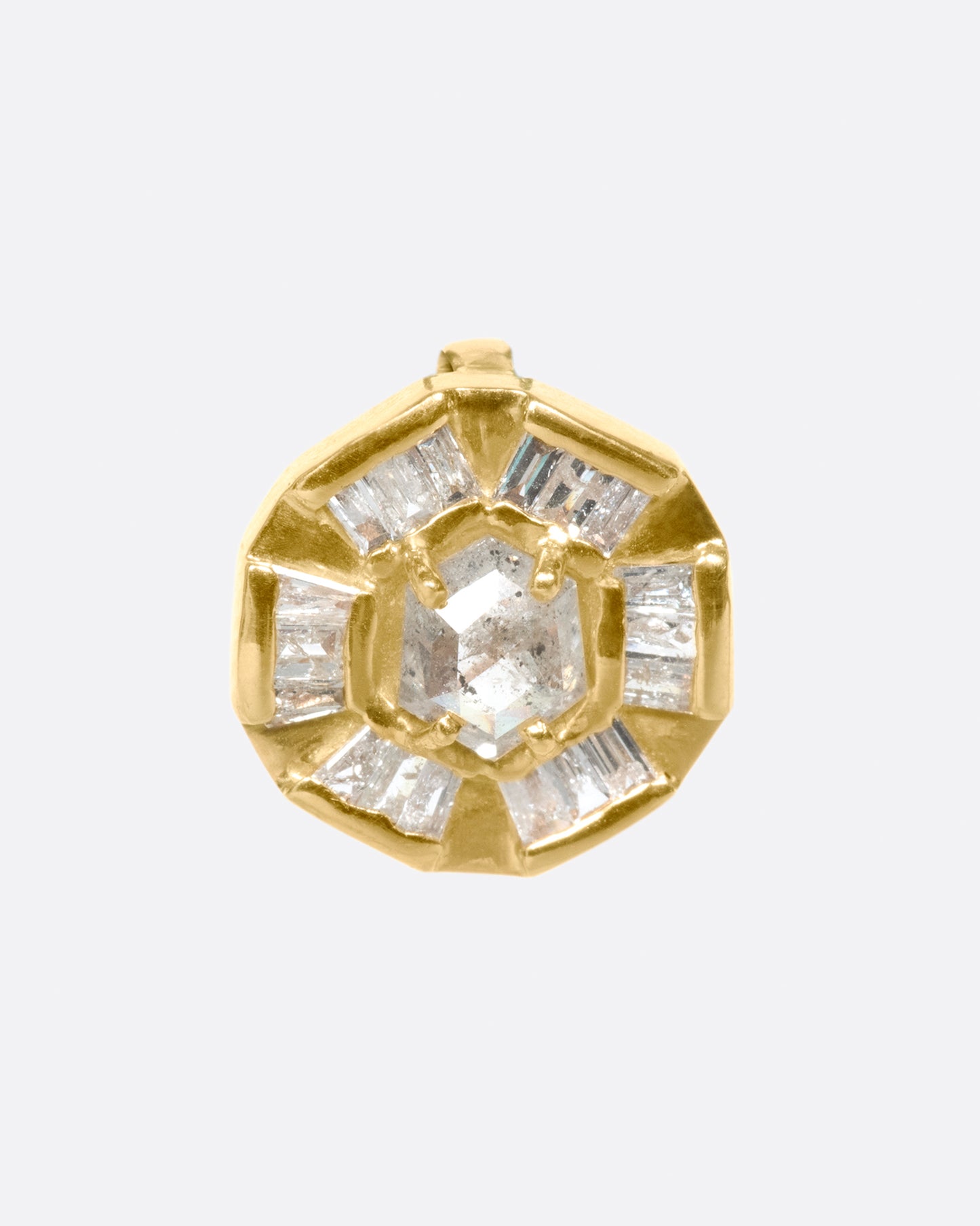 An alternative to a classic medal, this round pendant has a rose cut diamond at its center and is lined with baguettes.