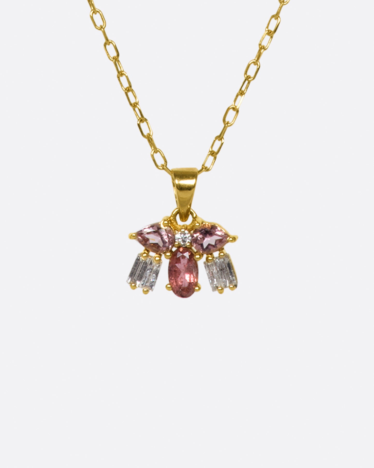 A tiny creature made from tourmalines and diamonds, hanging on a delicate chain.