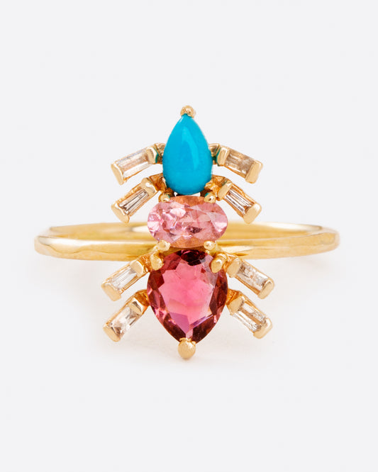 A crystalline critter to crawl on your finger; this composition of pink tourmalines, turquoise, and diamonds forms an elegant ant.