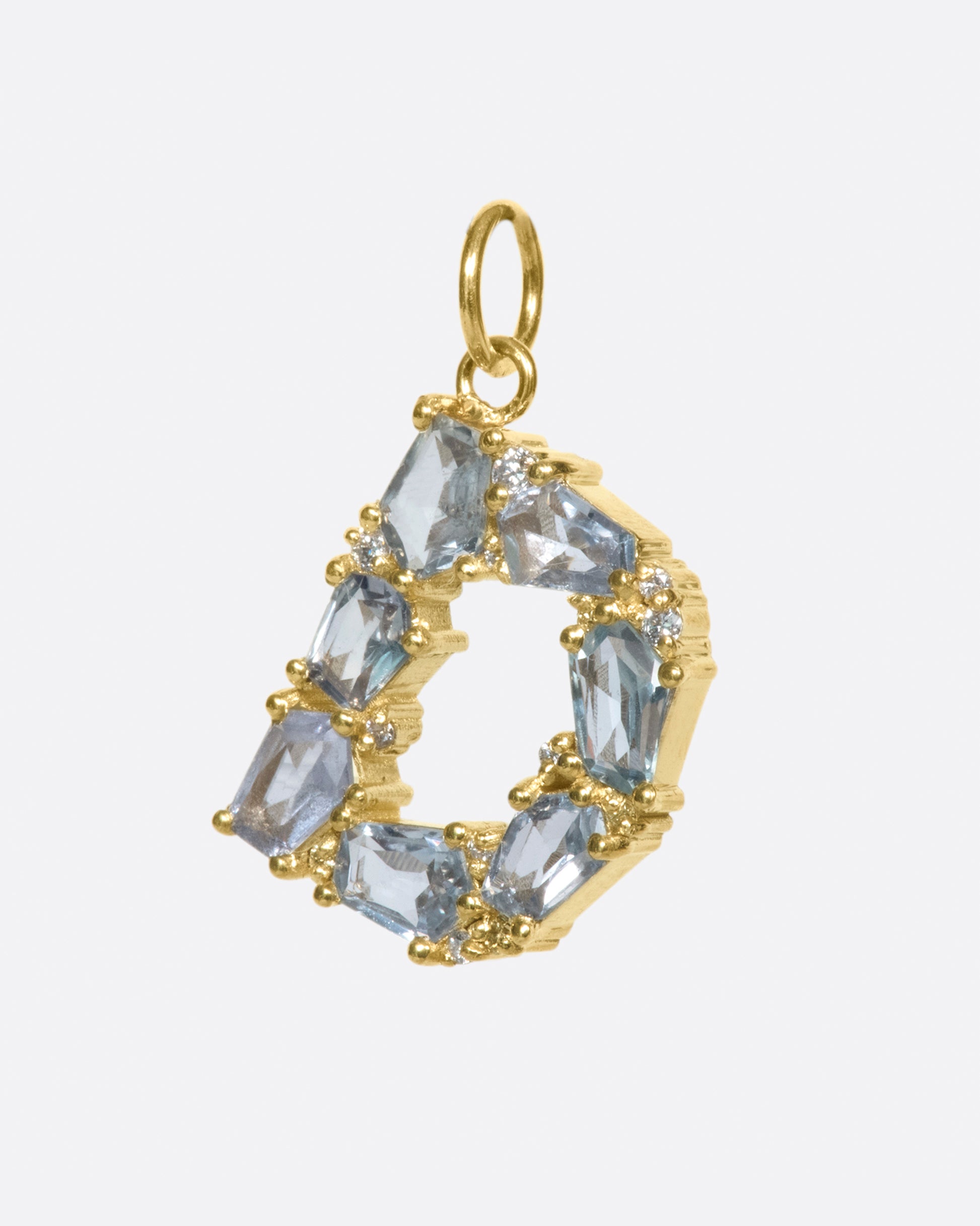 One of ERA's signature mosaic letter pendants, this time with light blue sapphires and diamonds.