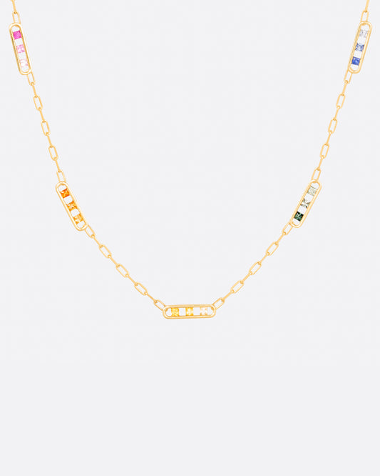 A chain necklace with five stations filled with rainbow ombré sapphires.