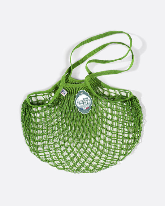A bright, apple green bag for eco-friendly grocery shopping.