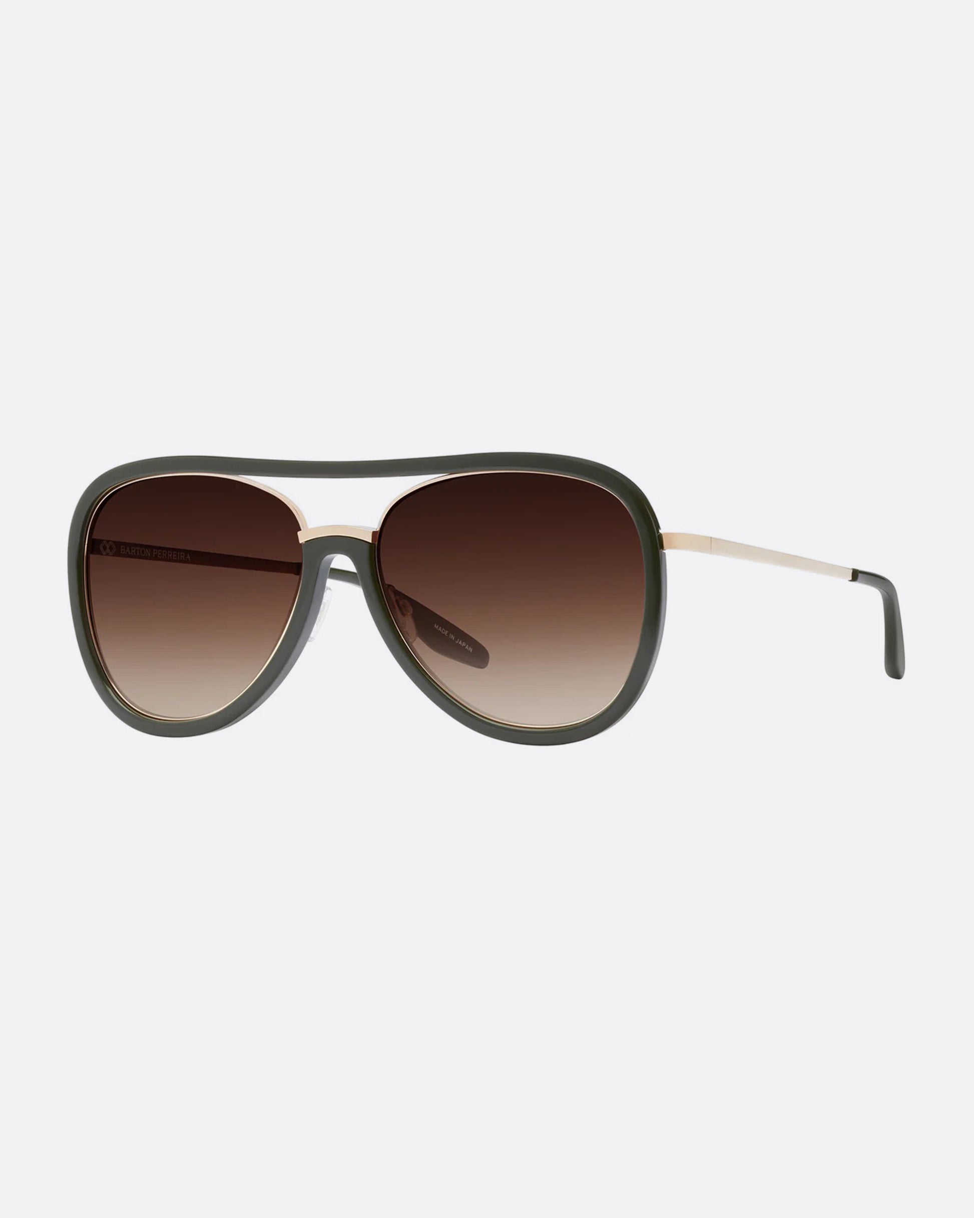 A pair of aviator sunglasses with green frames and  an inlaid titanium bridge. The lenses are a brown gradient. Shown diagonally from the front.