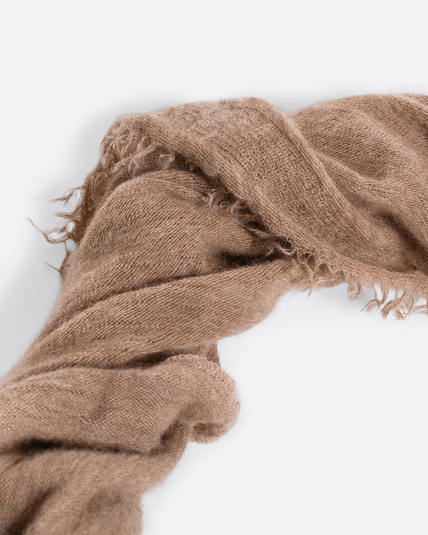 this is a rare cashmere piece you'll never take off. Style as a scarf, babushka, shawl, layer under chunky necklaces, or tie it on your bag. Available in warm beige, navy, black, and charcoal milk.