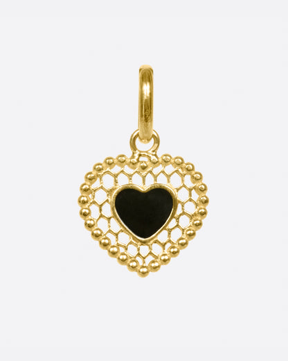 A vintage inspired heart charm that's still cool and new with its cutout details.