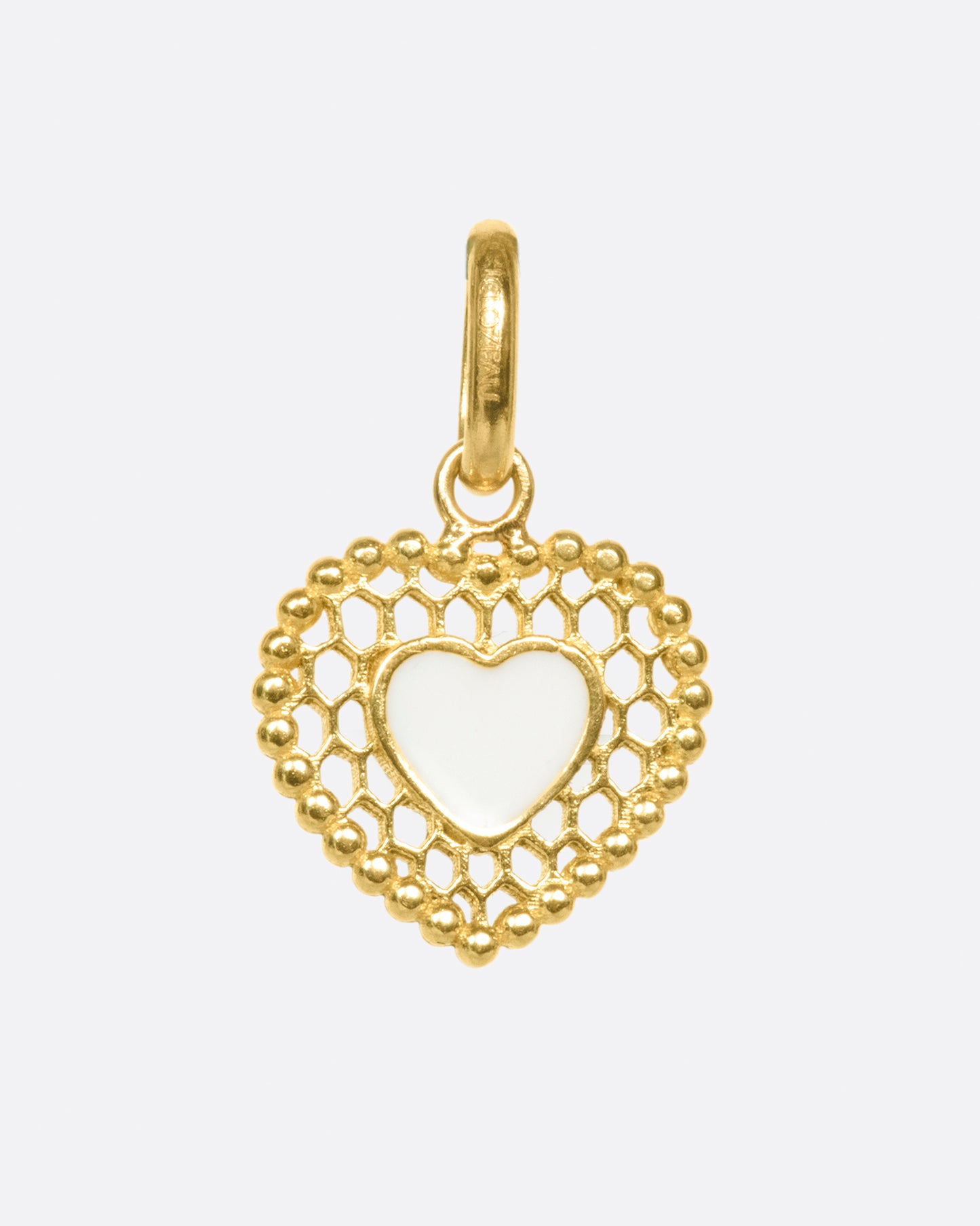 A vintage inspired heart charm that's still cool and new with its cutout details.
